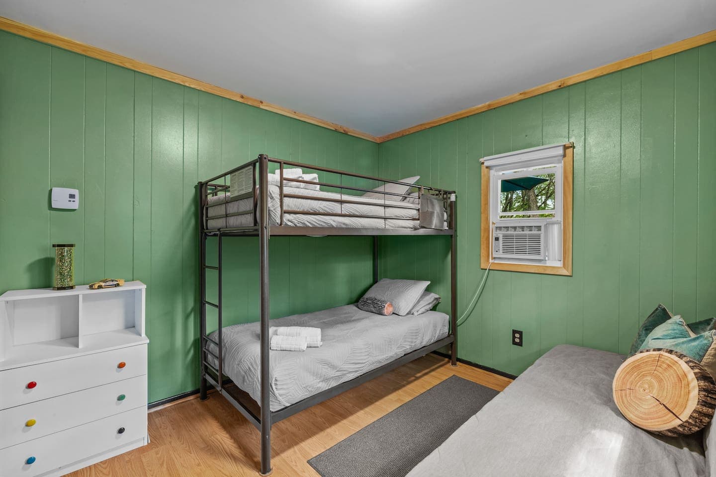 Kid-friendly room with a twin bunk bed and a full-size futon for extra sleeping space