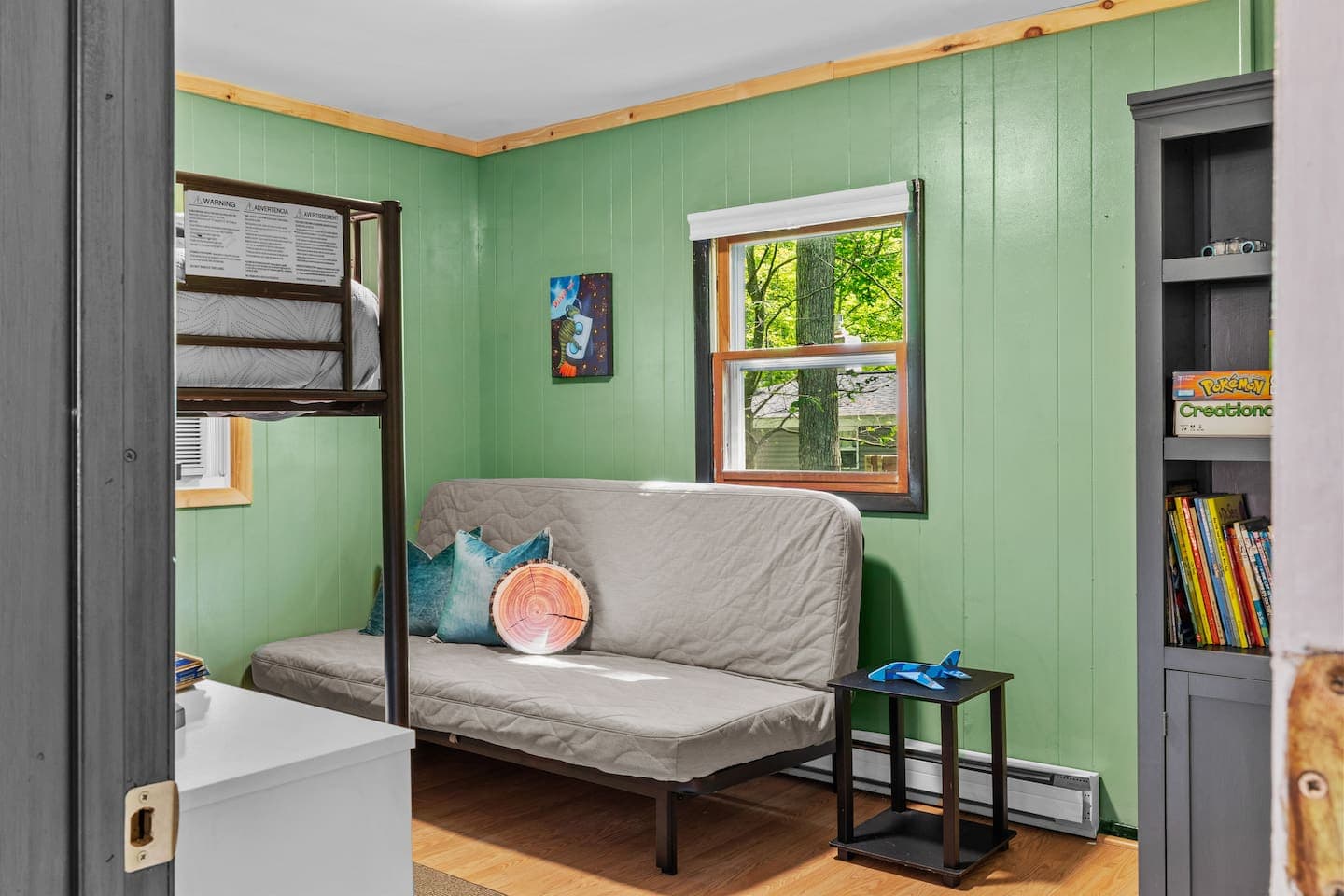 Kid-friendly room with a twin bunk bed and a full-size futon for extra sleeping space