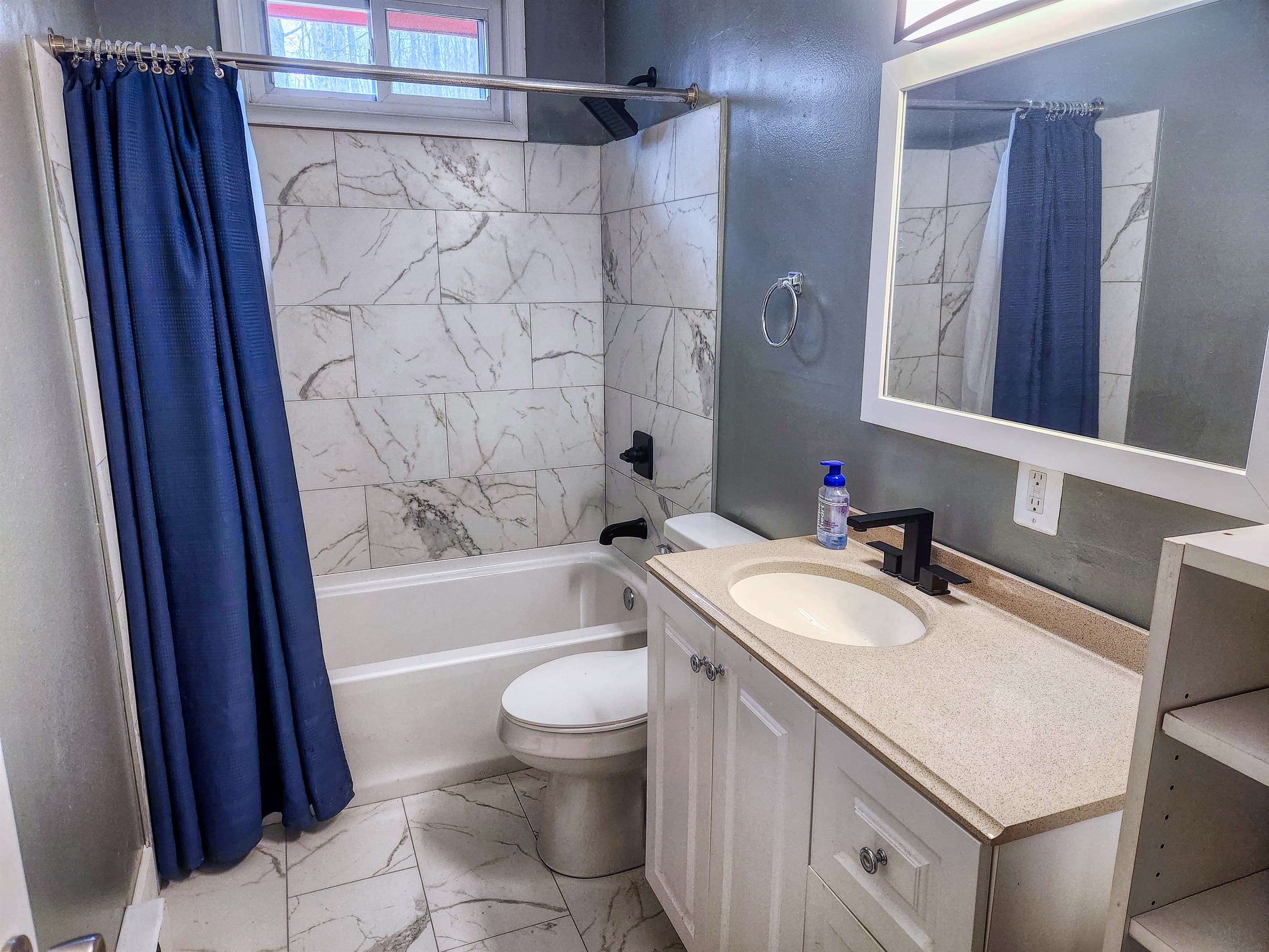 Upper level tiled bathroom