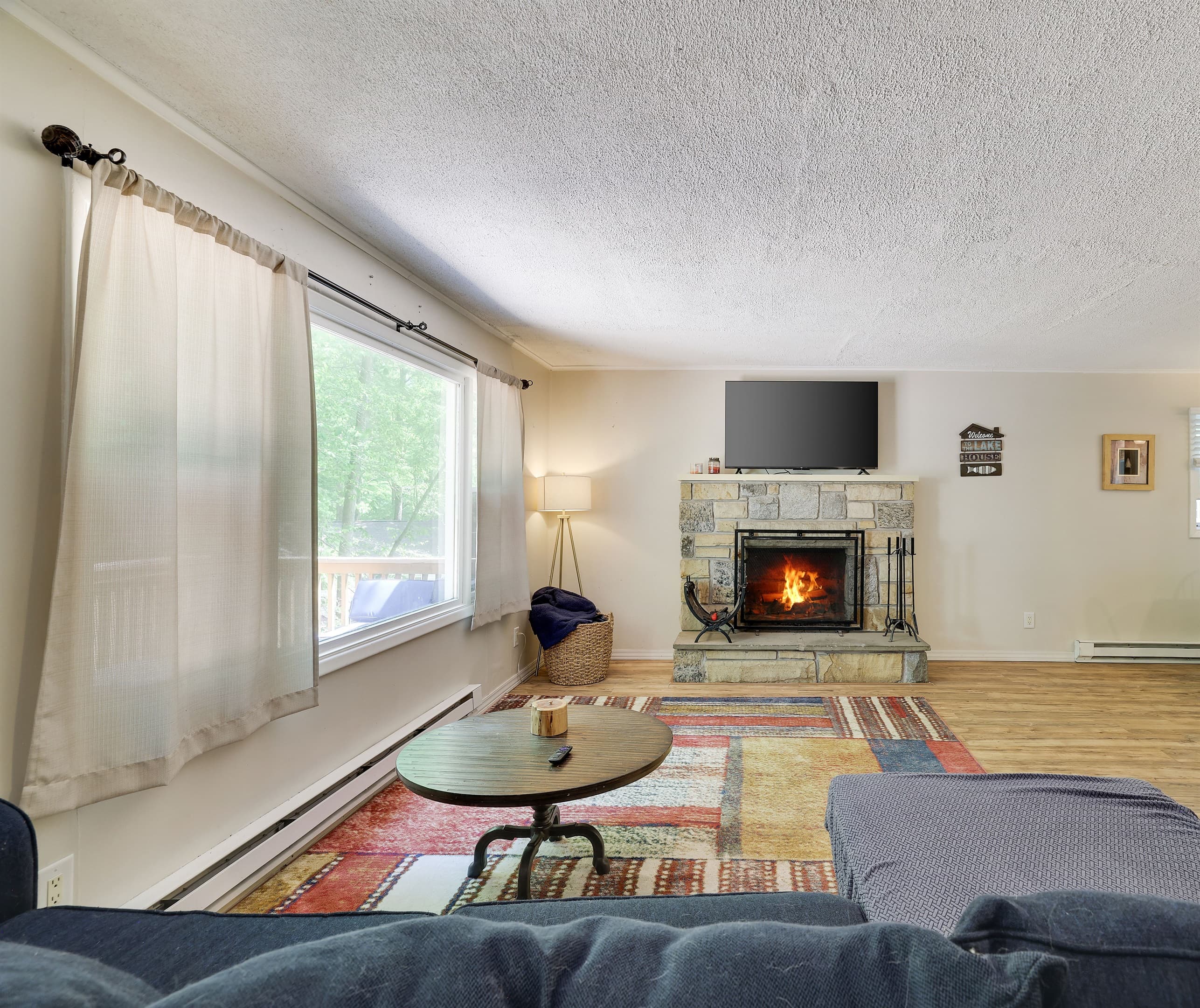 Upper level living room with fireplace