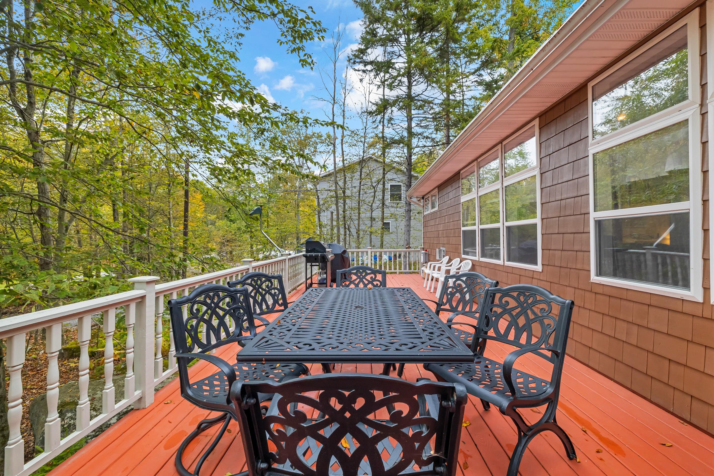 Large deck with outdoor dining and BBQ grill