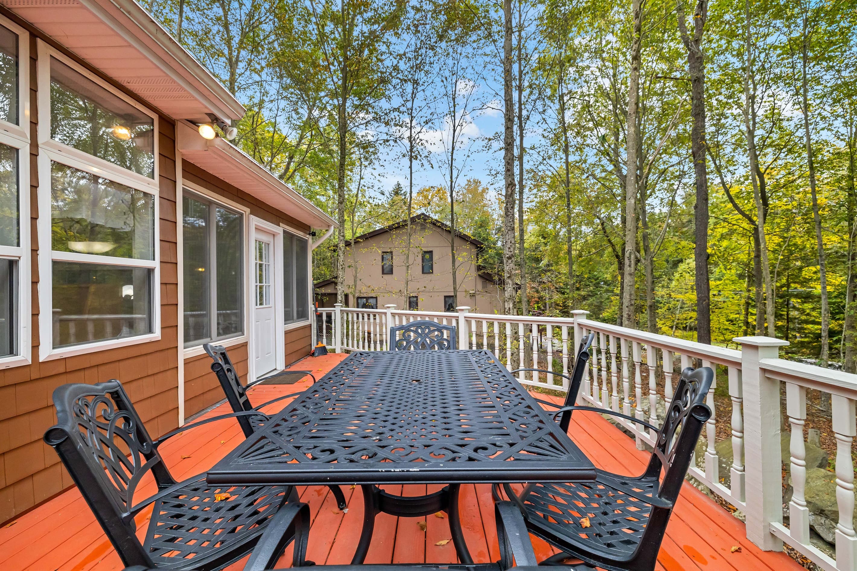 Large deck with outdoor dining and BBQ grill