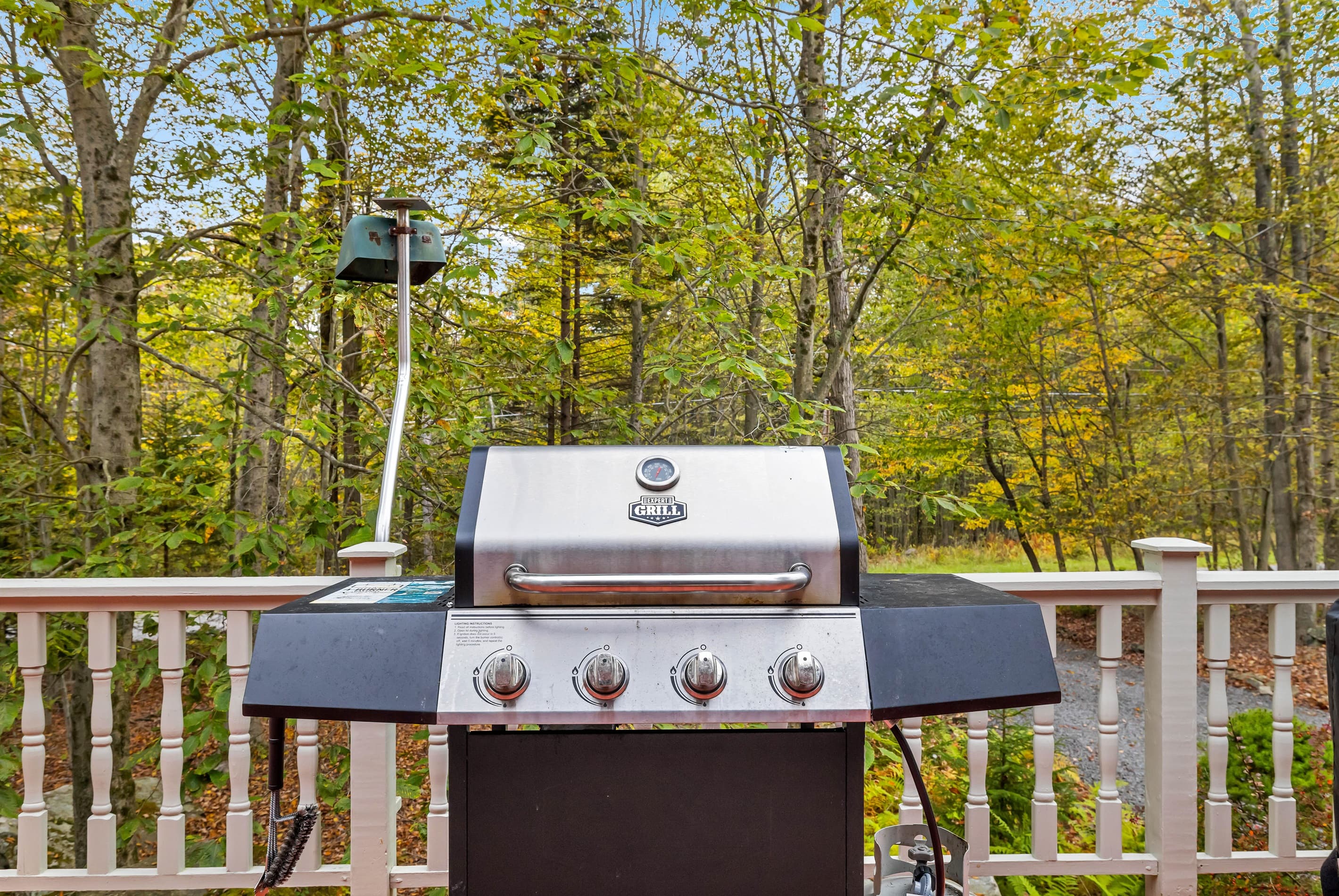 Large deck with outdoor dining and BBQ grill
