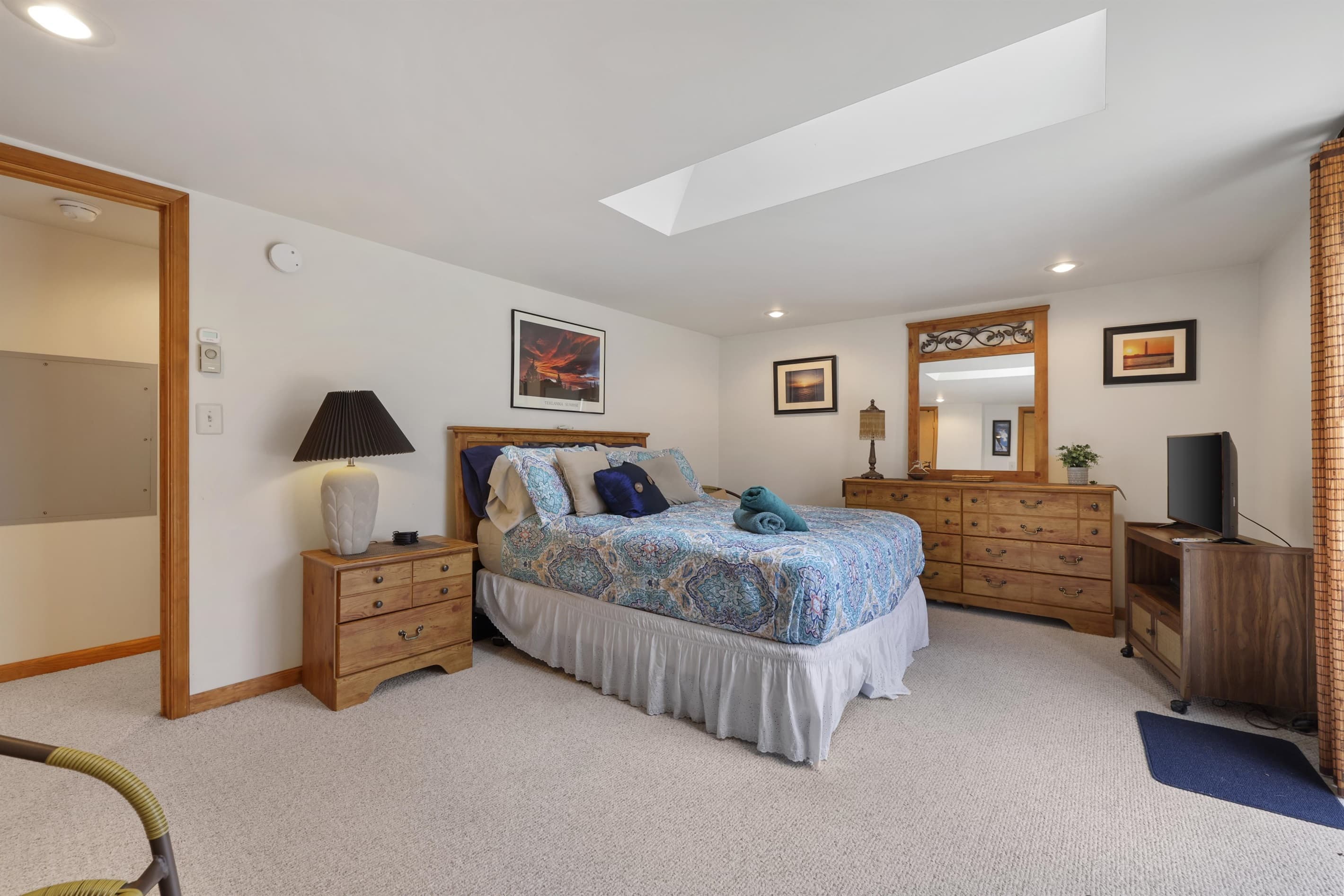 Upper floor bedroom with exit to deck
