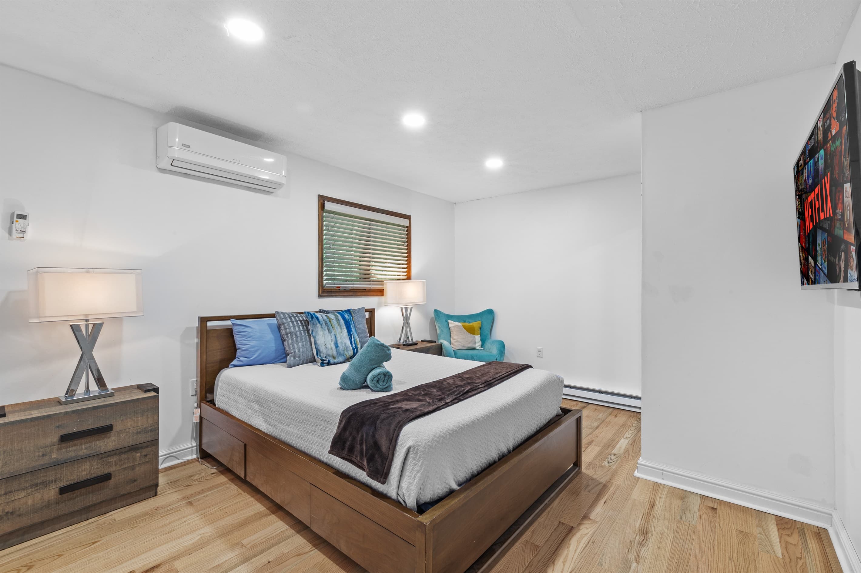 Bedroom 1 with queen bed and TV