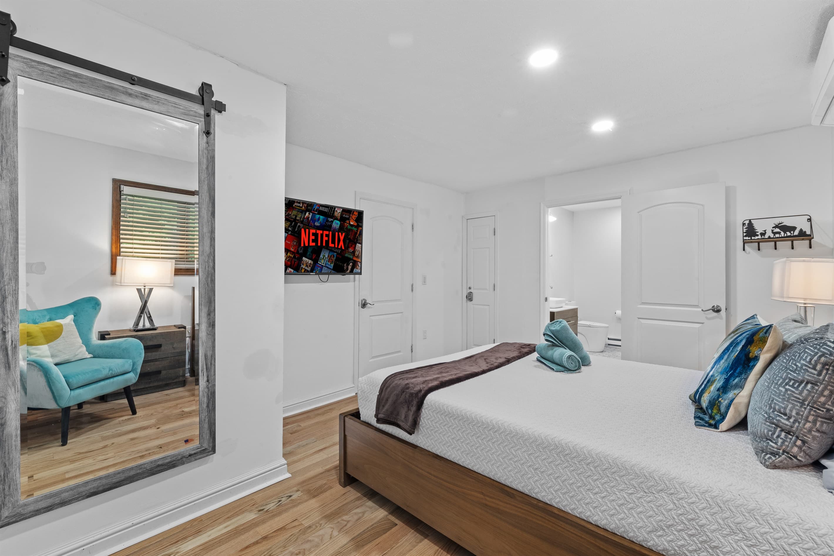 Bedroom 1 with queen bed and TV