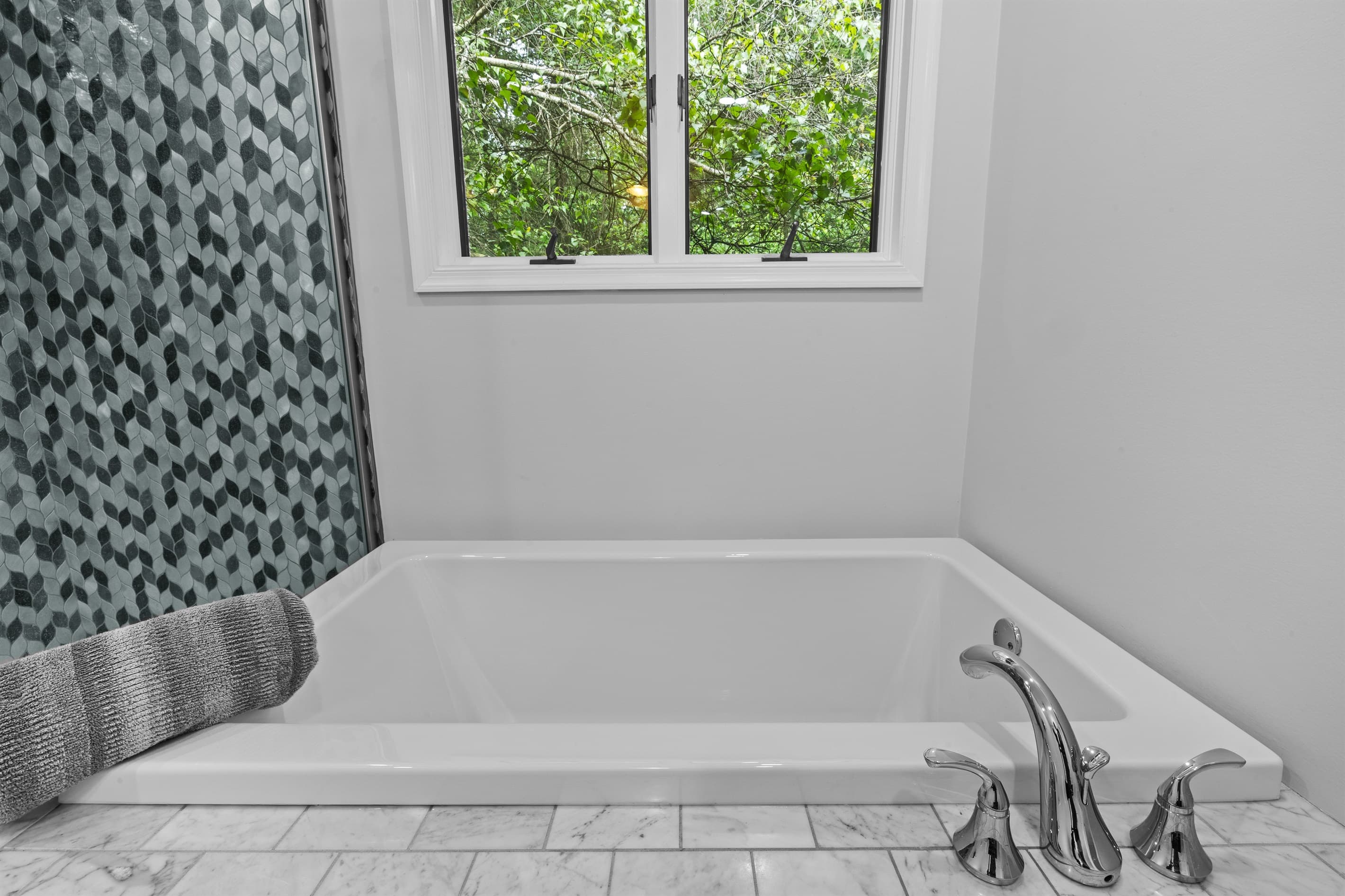 Spacious full bathroom featuring both a walk-in shower and soaking tub