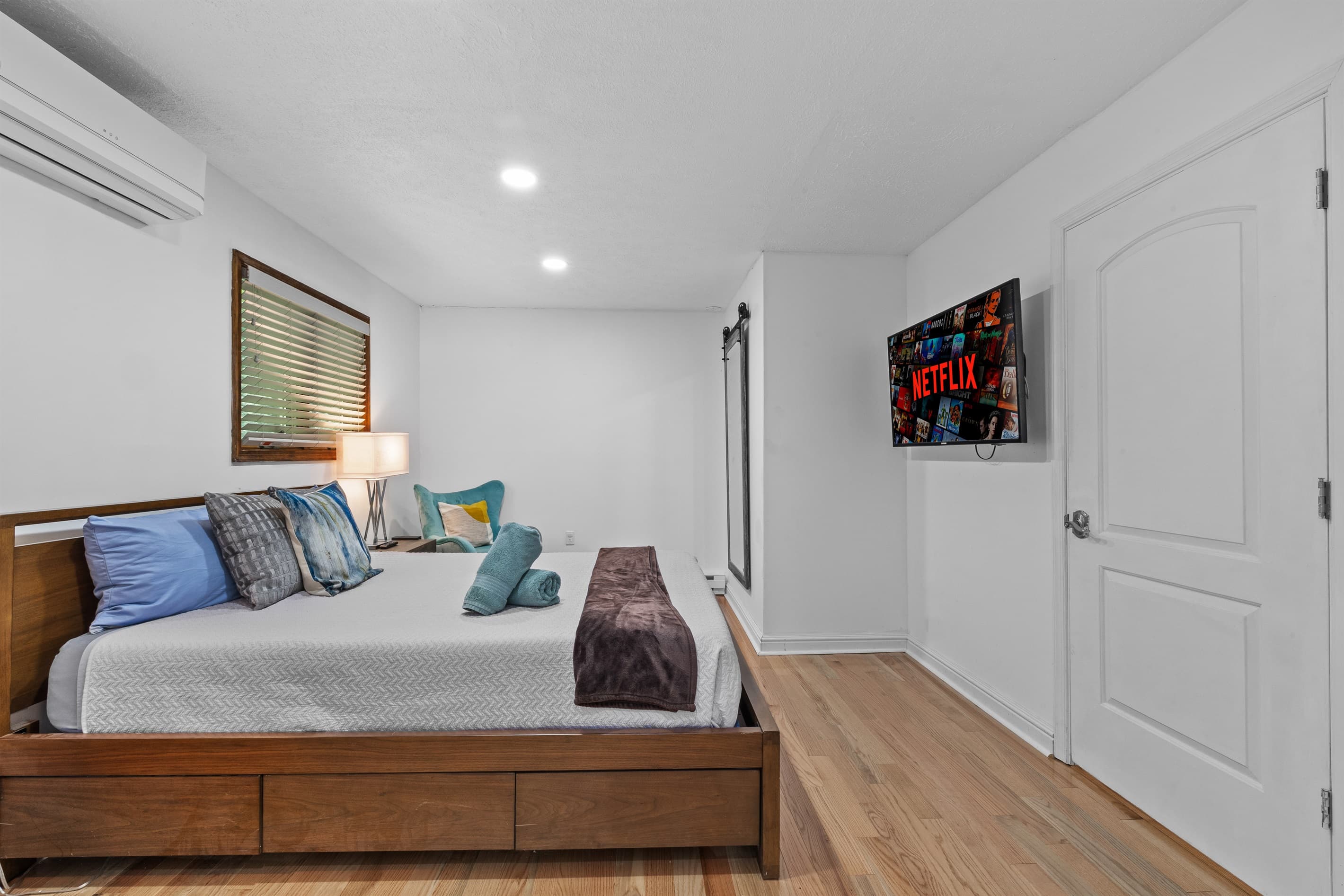 Bedroom 1 with queen bed and TV