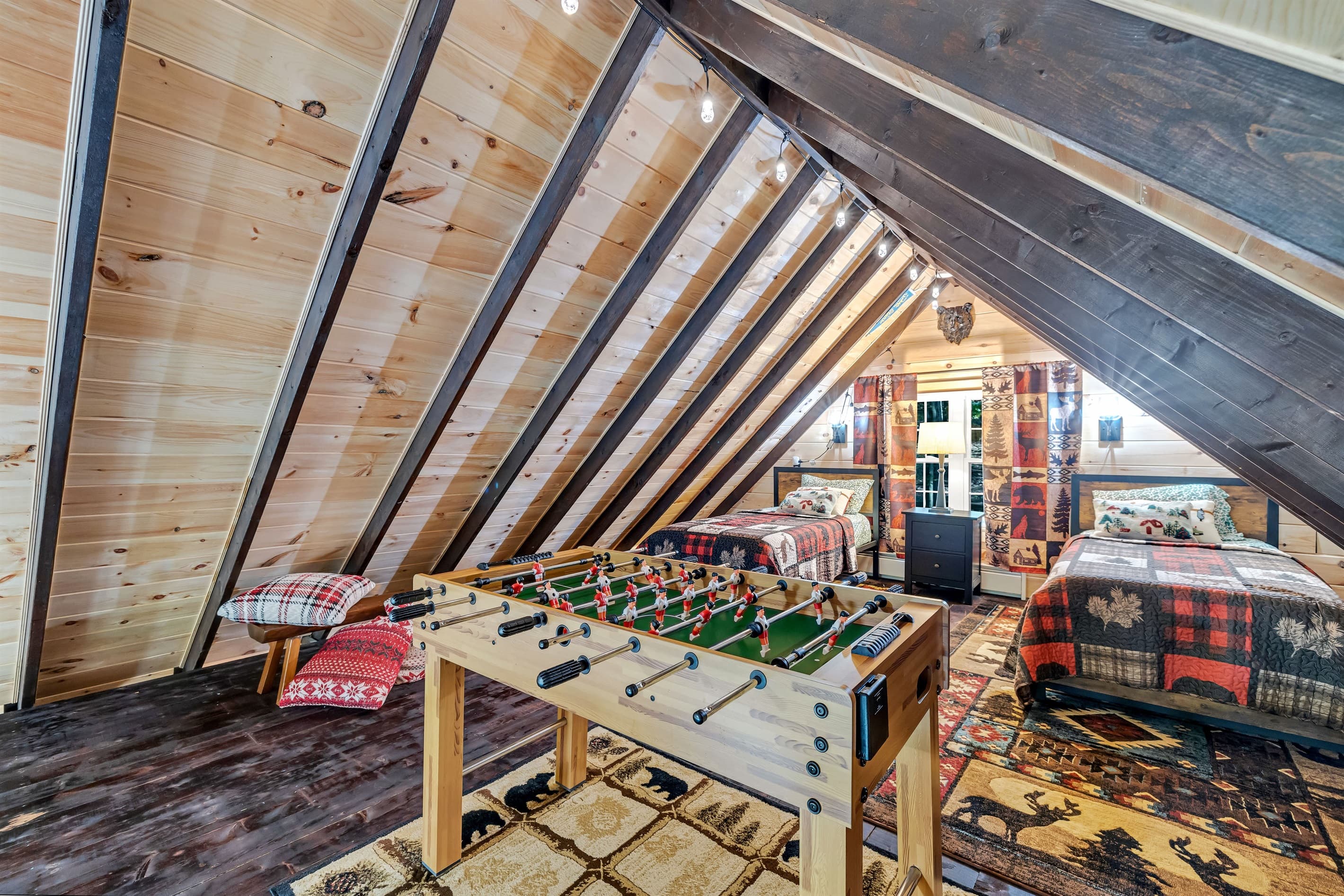 Loft with two twin beds and foosball table