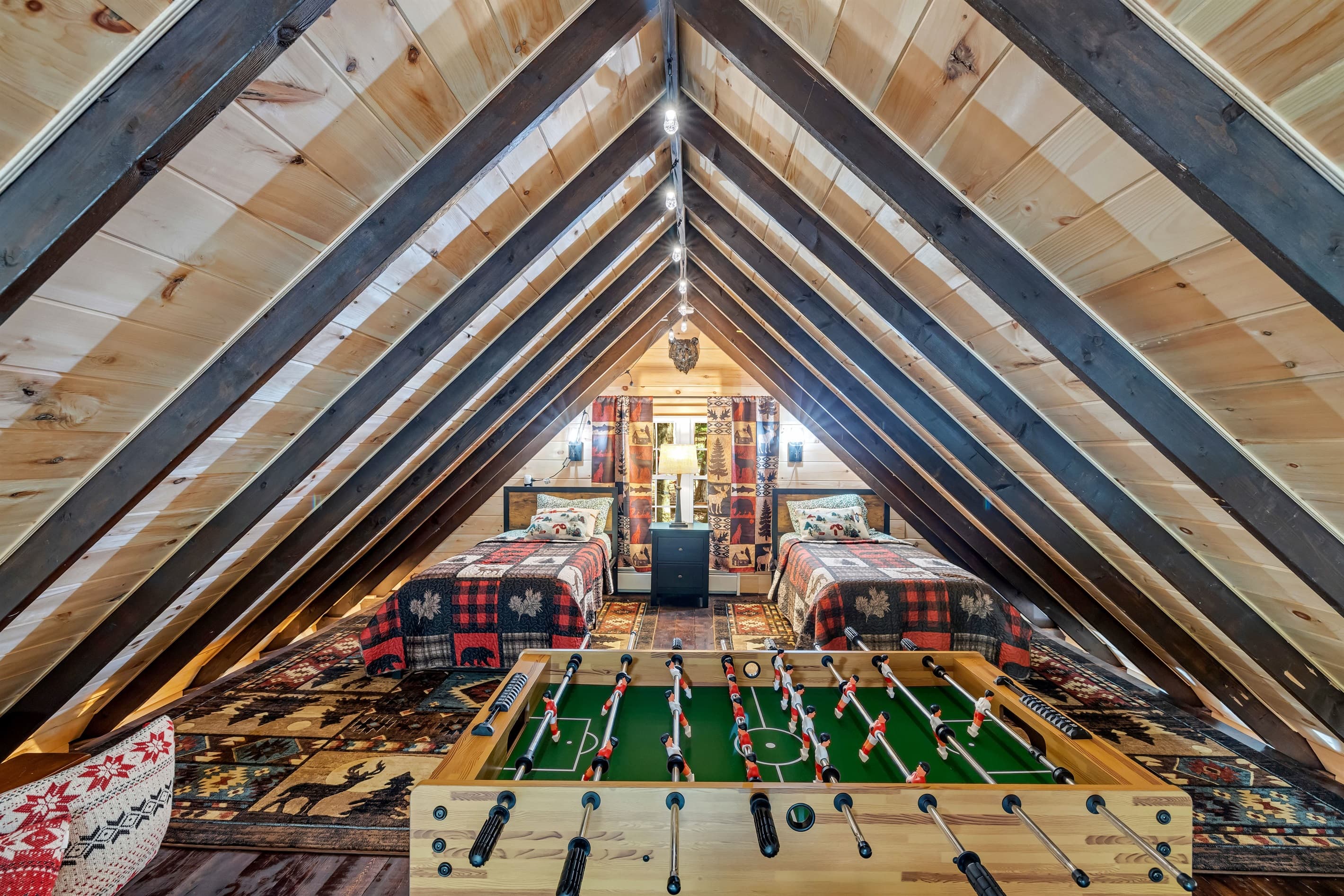 Loft with two twin beds and foosball table