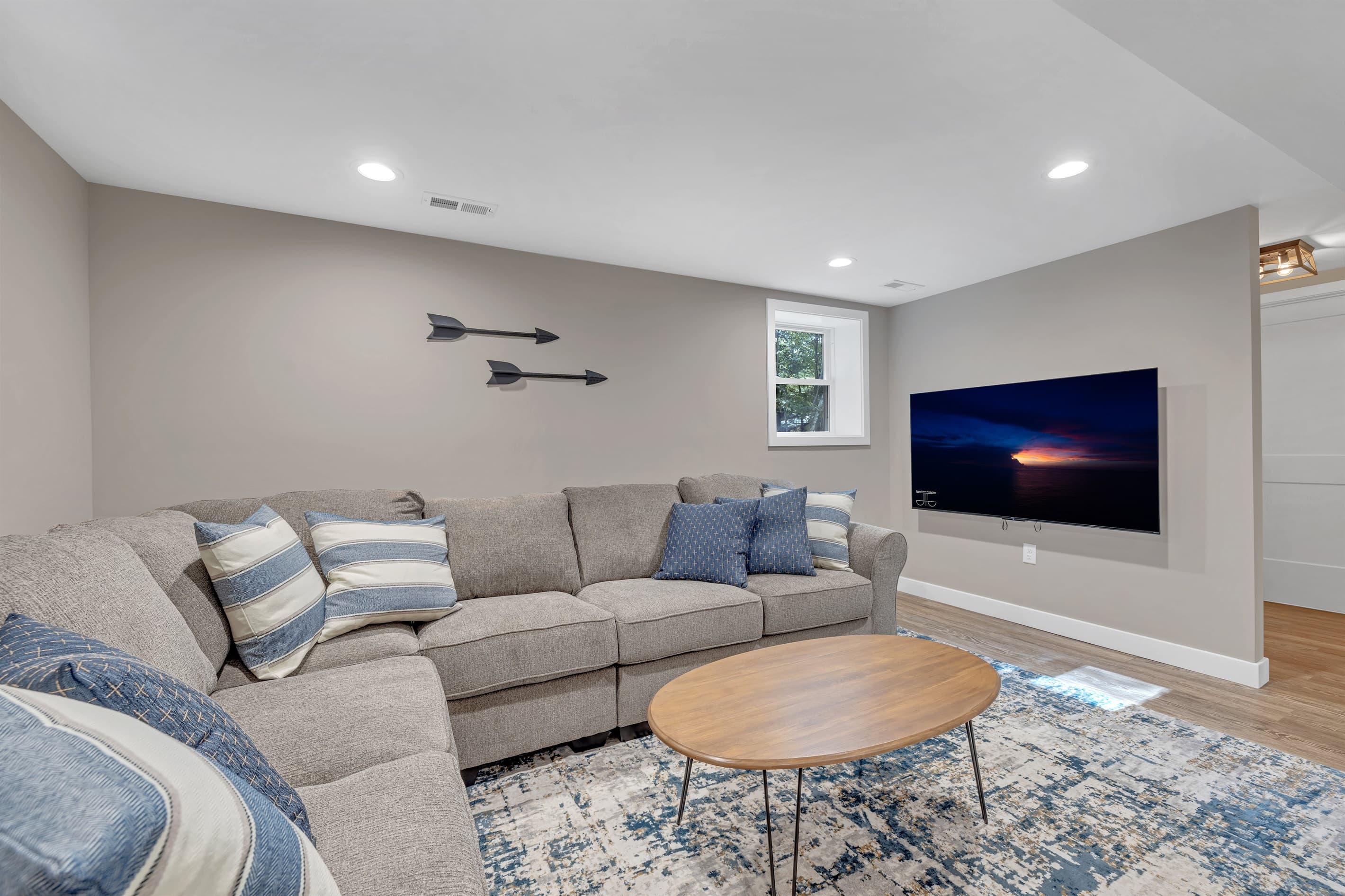 Comfortable sectional and large TV on the ground floor
