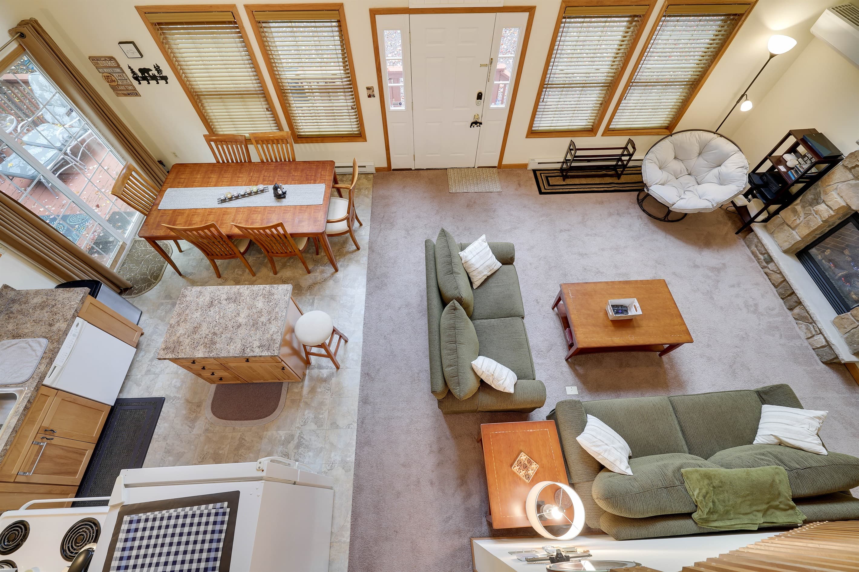 Living room with gas fireplace, comfortable couches, TV and coffee table