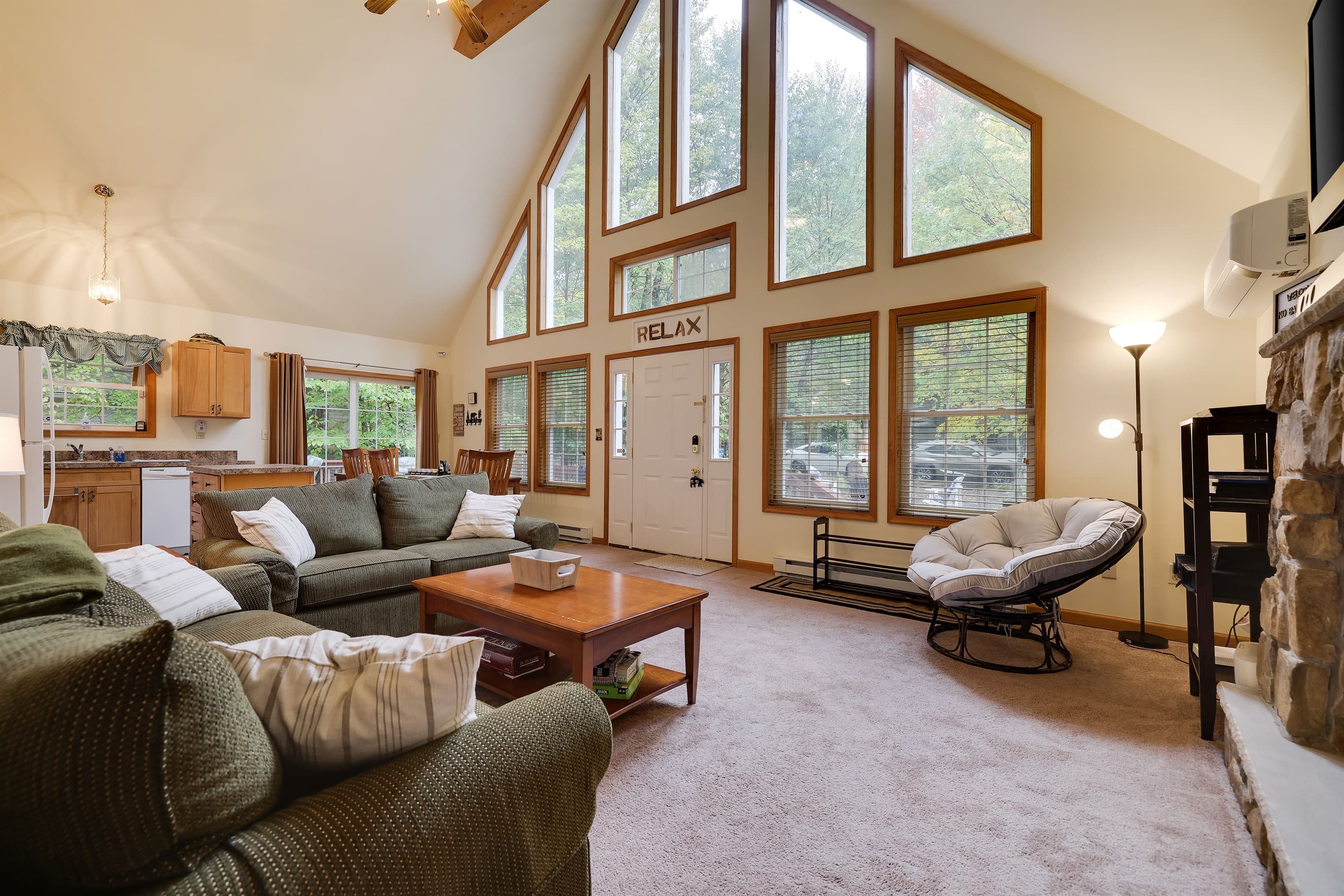 Living room with gas fireplace, comfortable couches, TV and coffee table