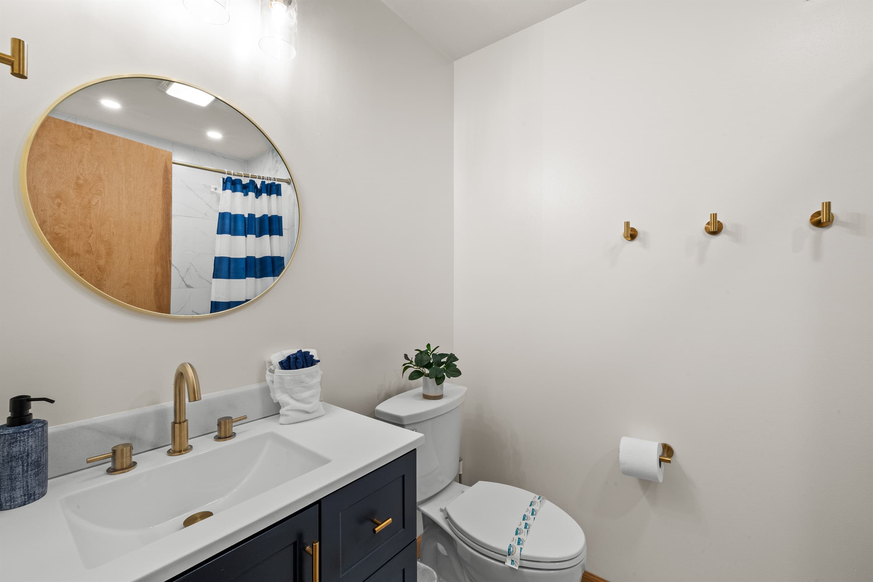 Full bathroom with a bathtub and toilet, ideal for family use.