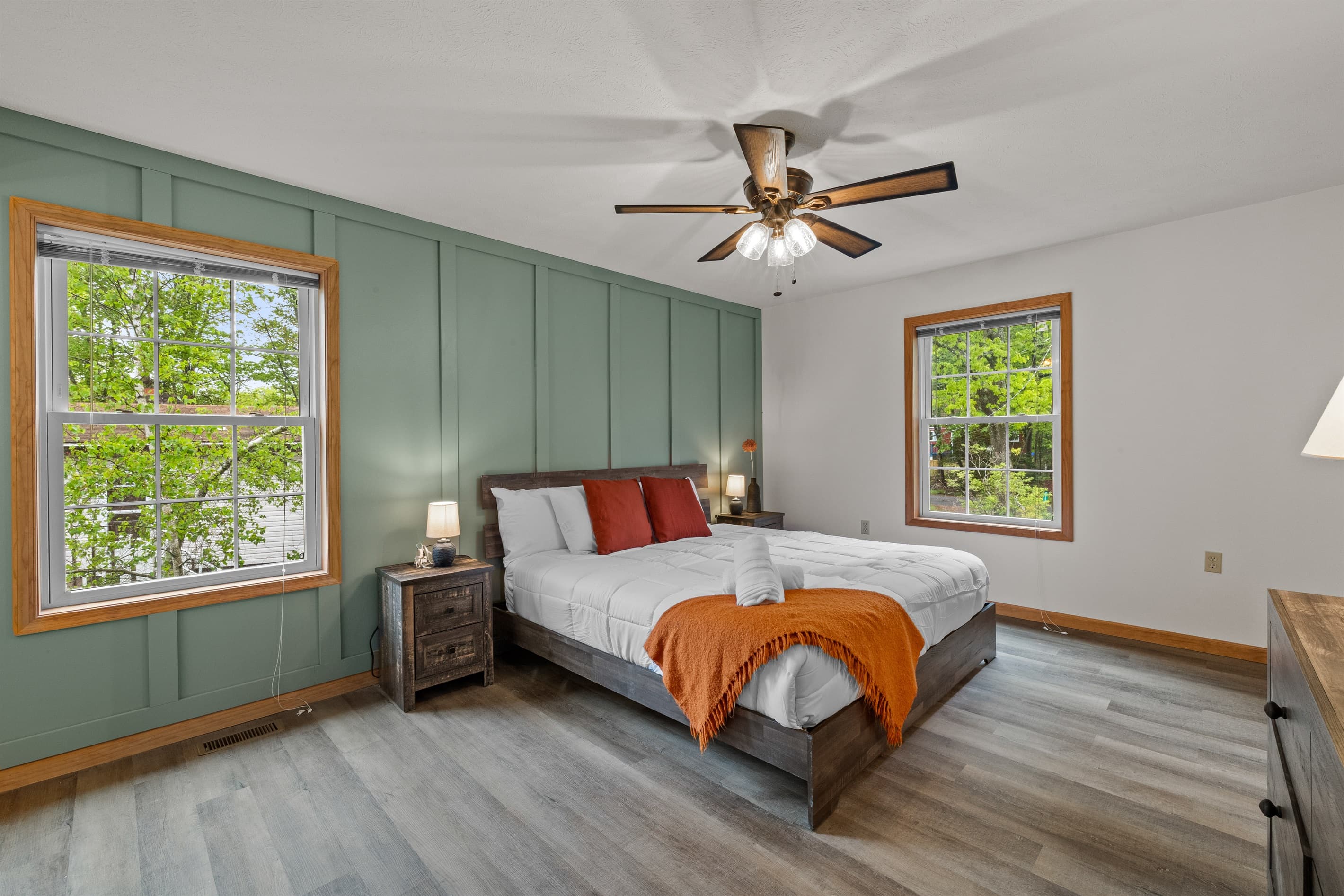 Primary bedroom with a king-size bed and private ensuite bathroom for added comfort.