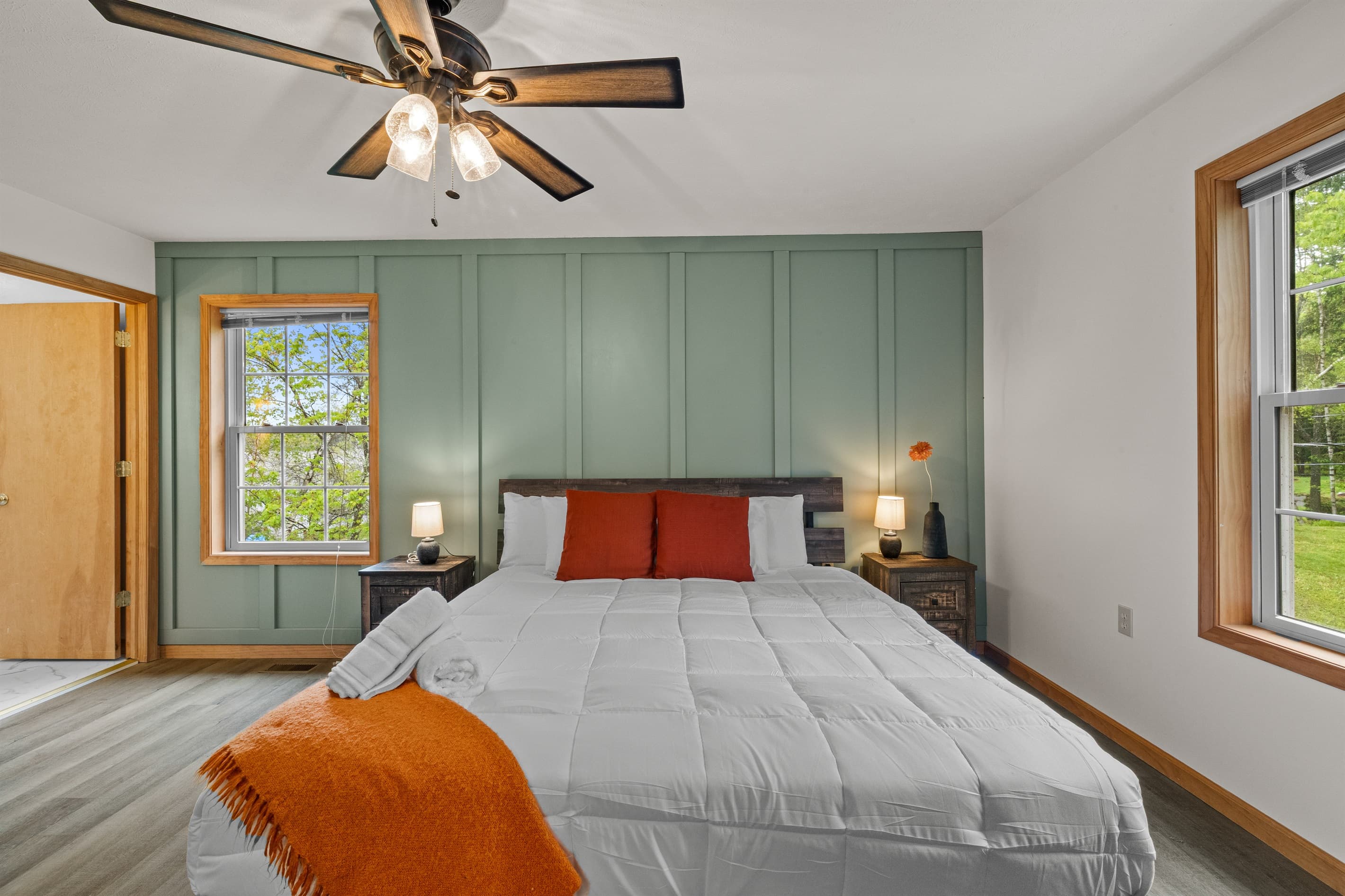 Primary bedroom with a king-size bed and private ensuite bathroom for added comfort.