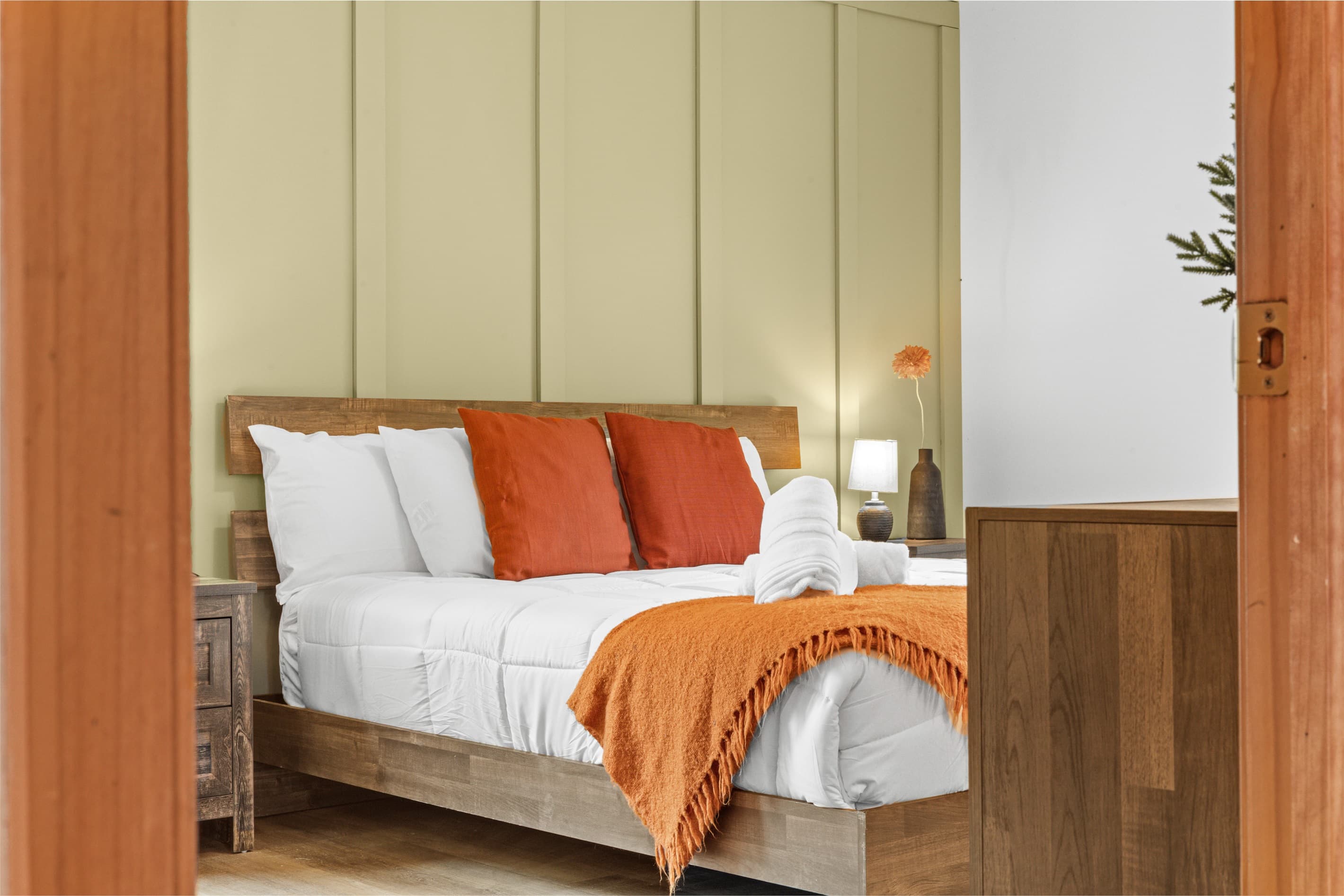 Primary bedroom with a king-size bed and private ensuite bathroom for added comfort.