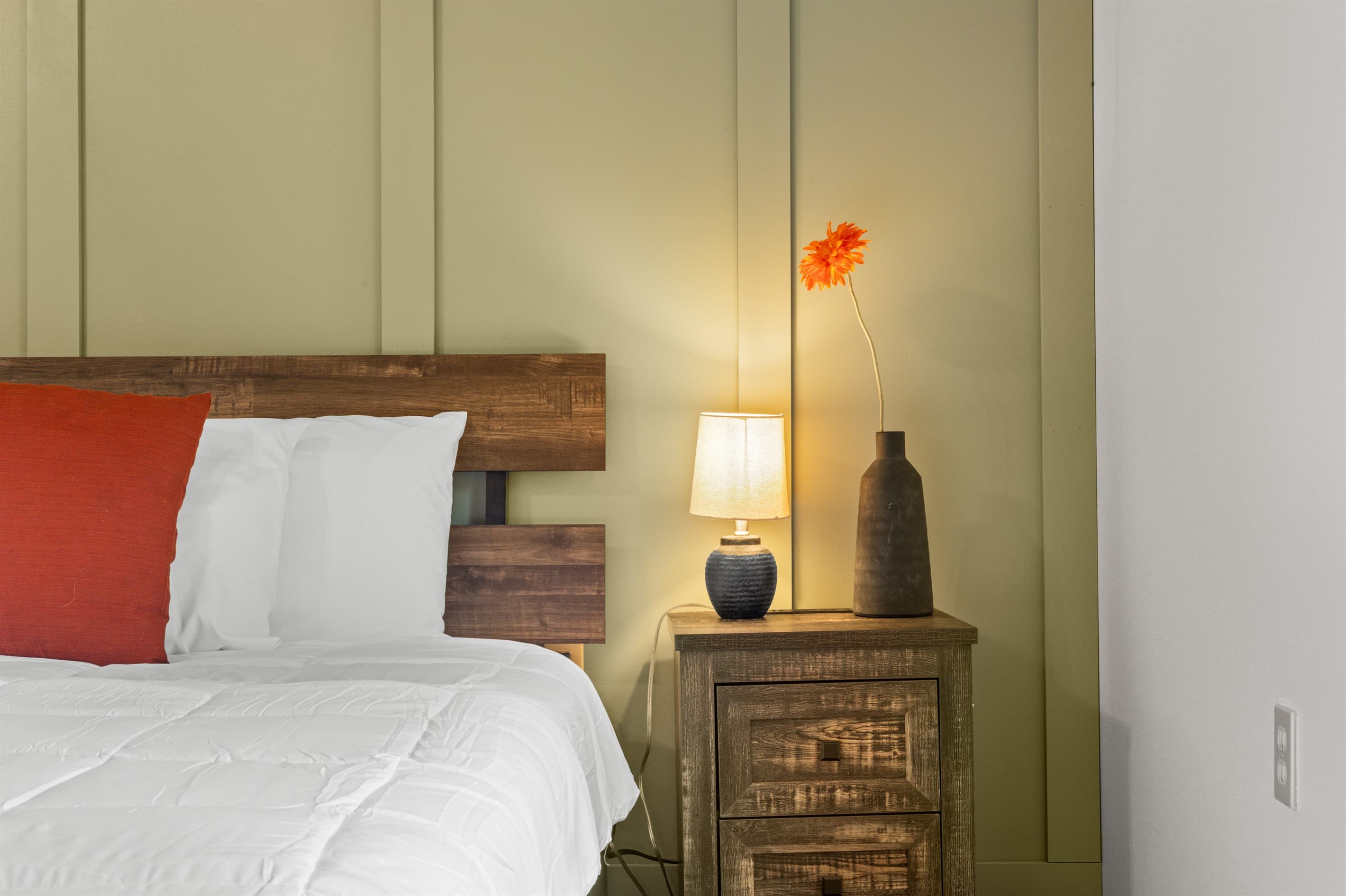 Primary bedroom with a king-size bed and private ensuite bathroom for added comfort.