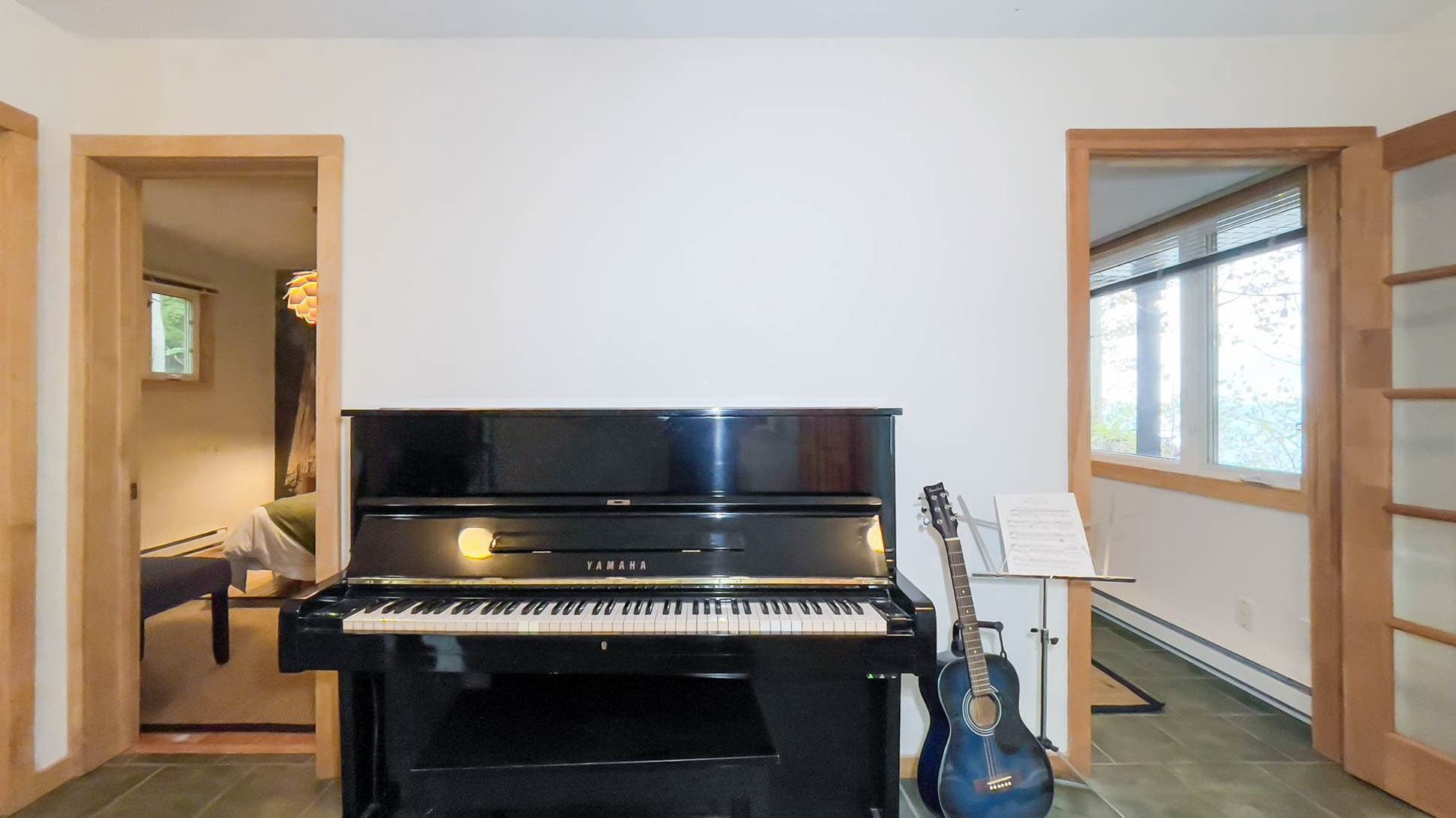 Piano & Junior guitar with access to back deck/yard