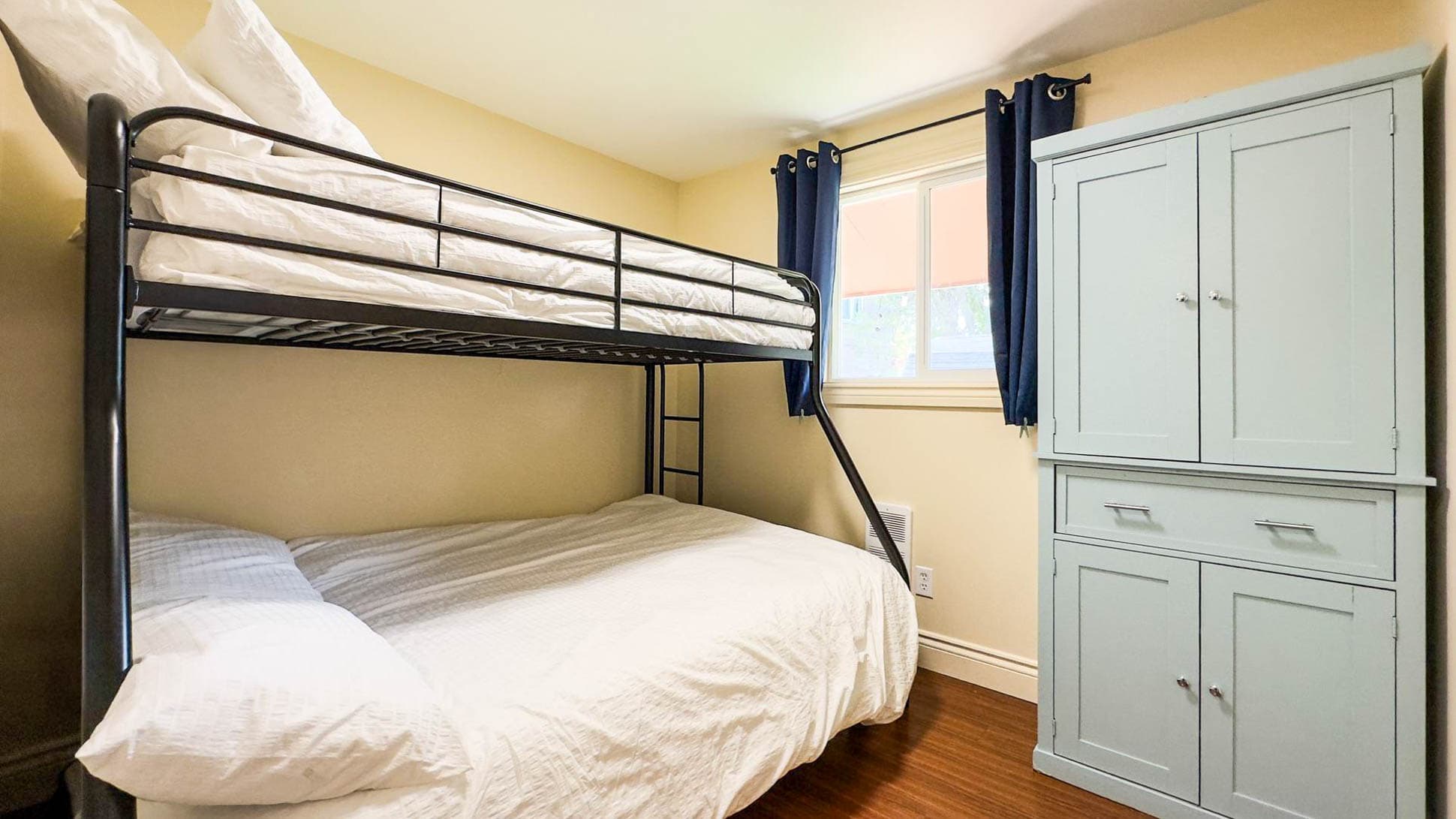 Bedroom 2 has Single over Double Bunk Bed. Plus a twin bed that slides from underneath
