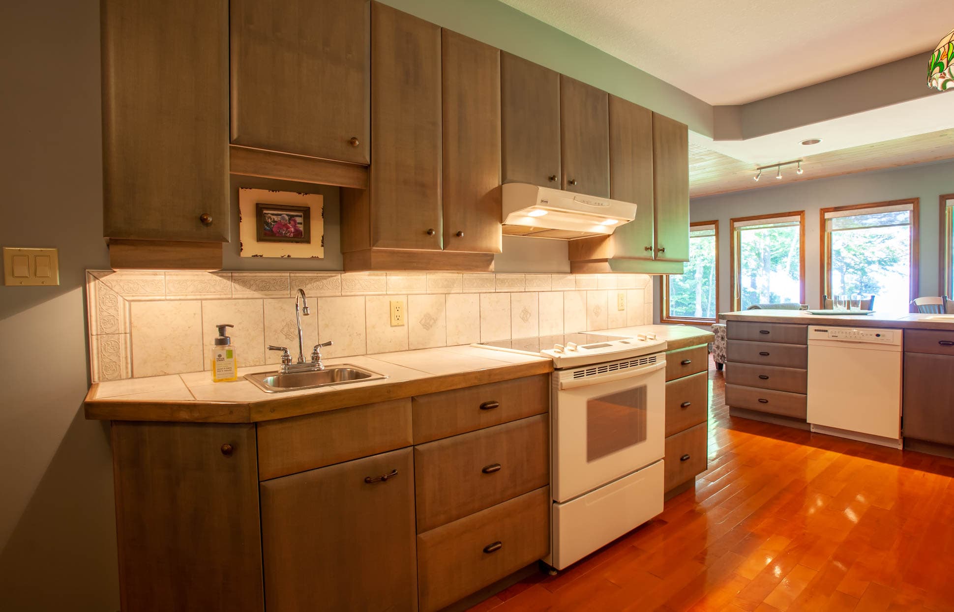 Large kitchen area with plenty of counter space and appliances