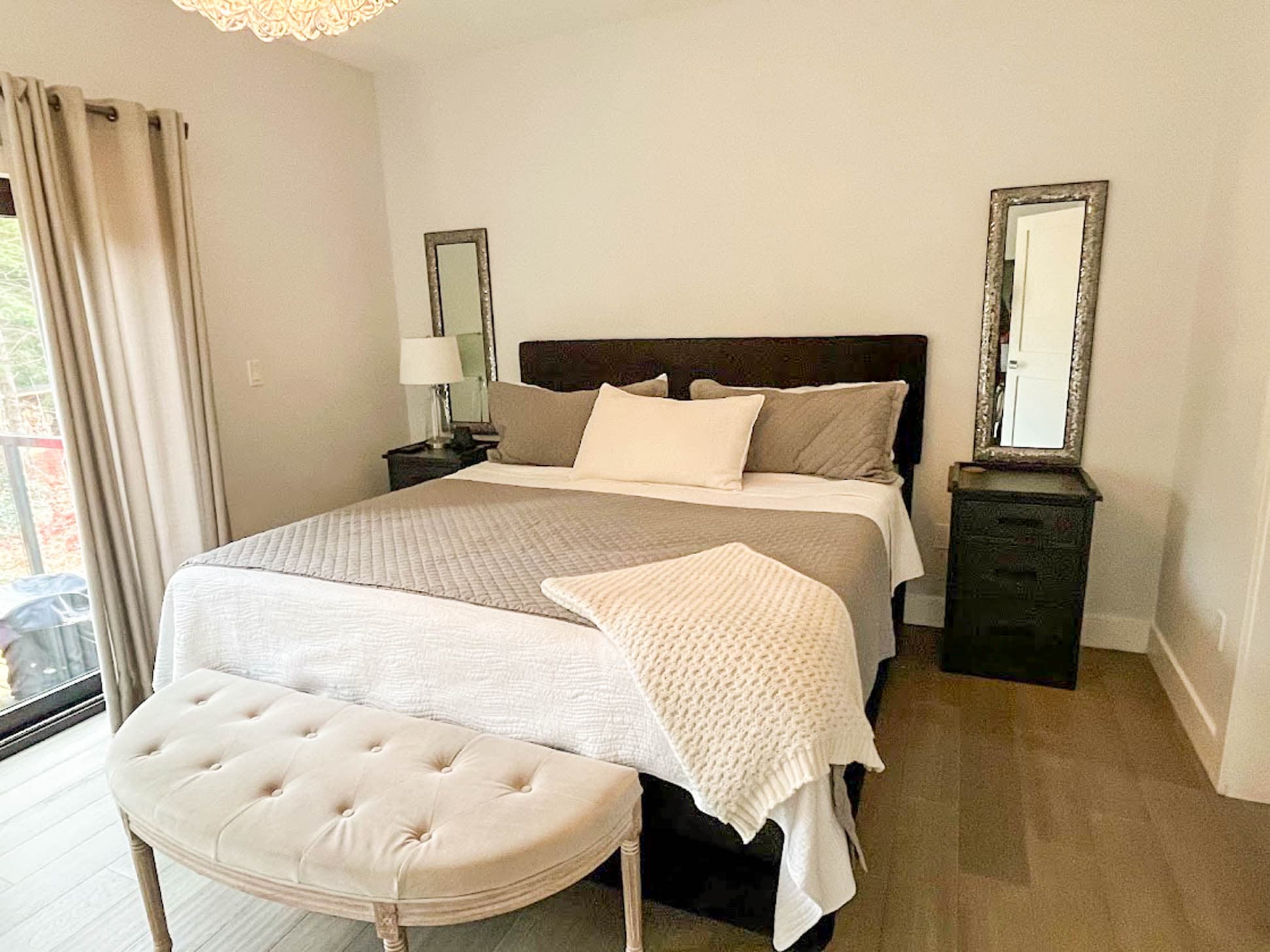 Main floor premiere bedroom with easy access to backyard deck