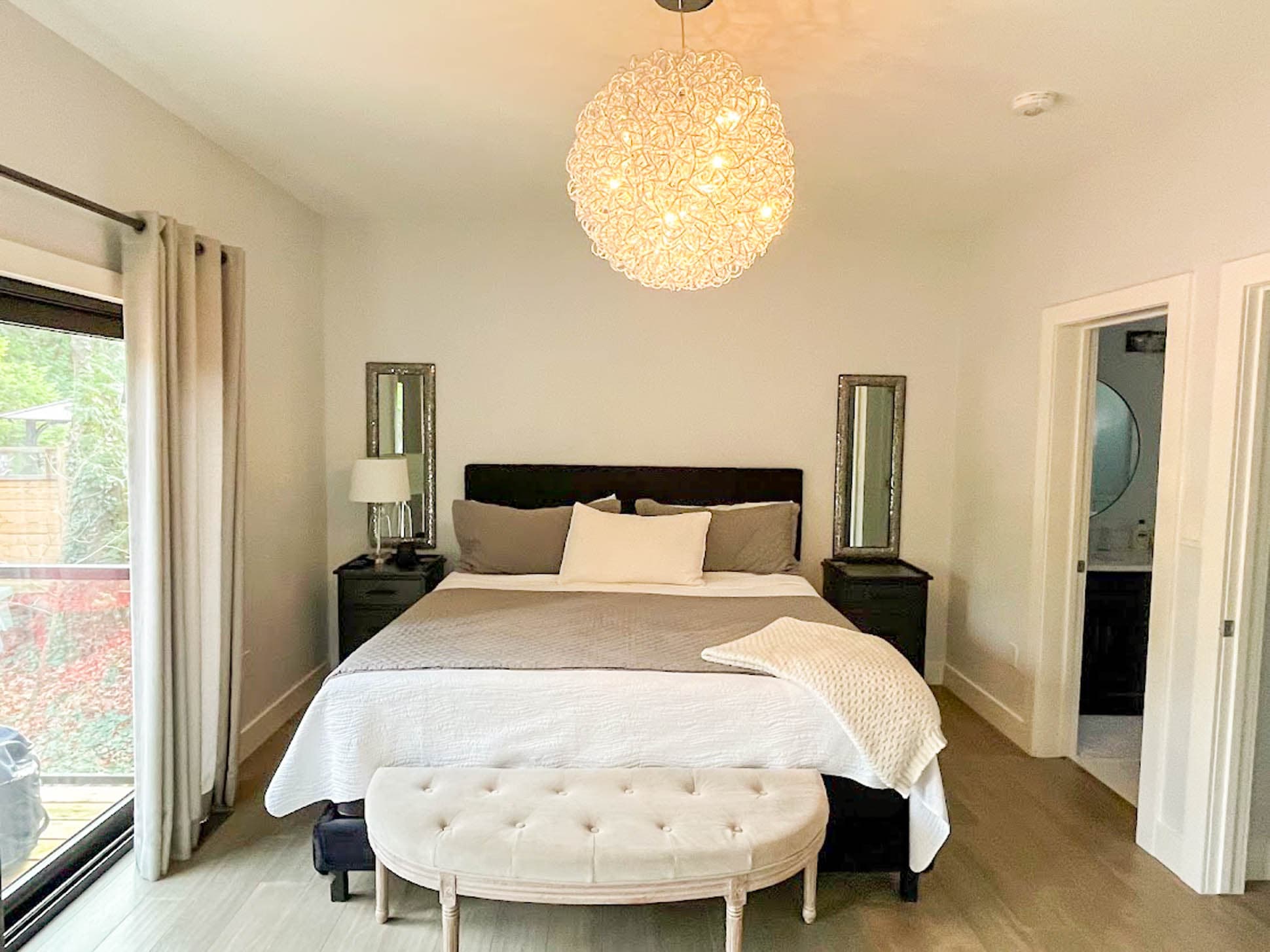 Main floor premiere bedroom with king bed and ensuite bathroom