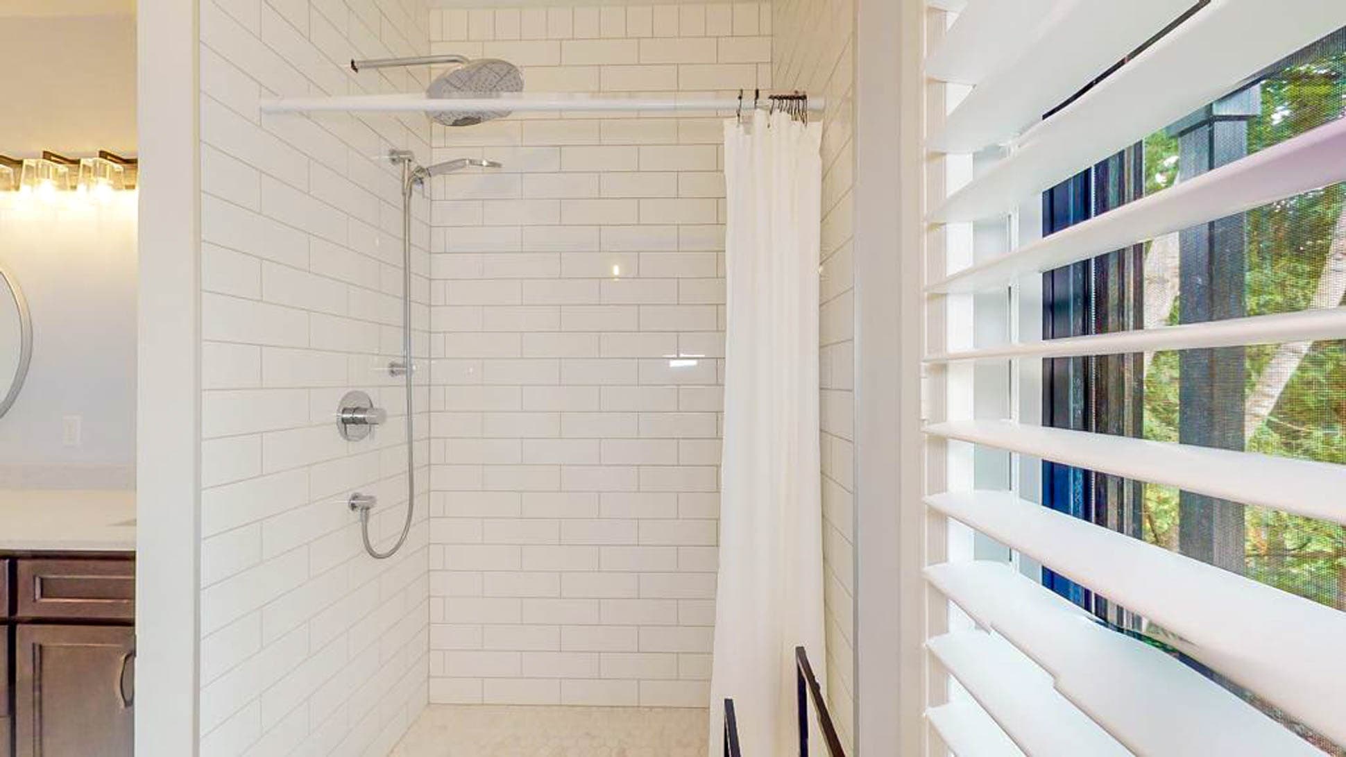 Oversized shower stall with two showerhead options