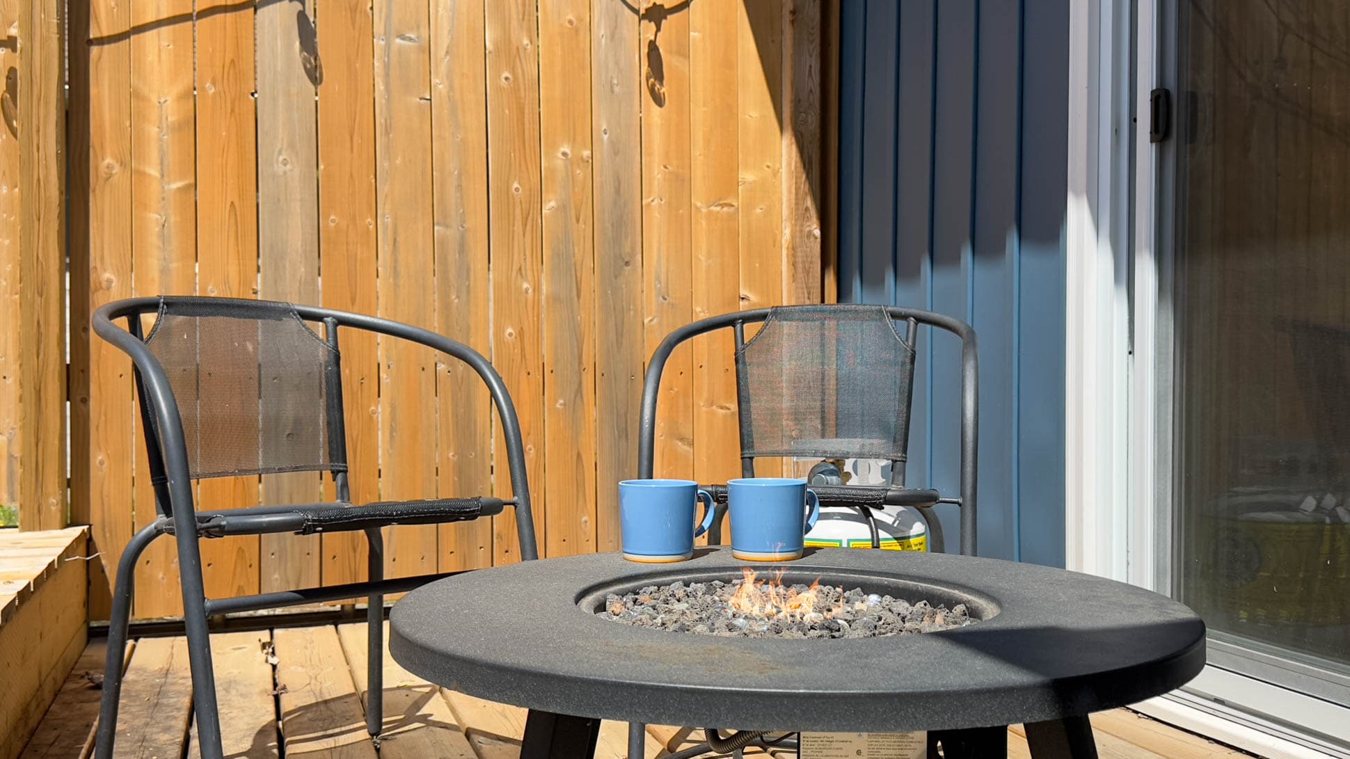 Right off the premier bedroom, cozy gas firetable