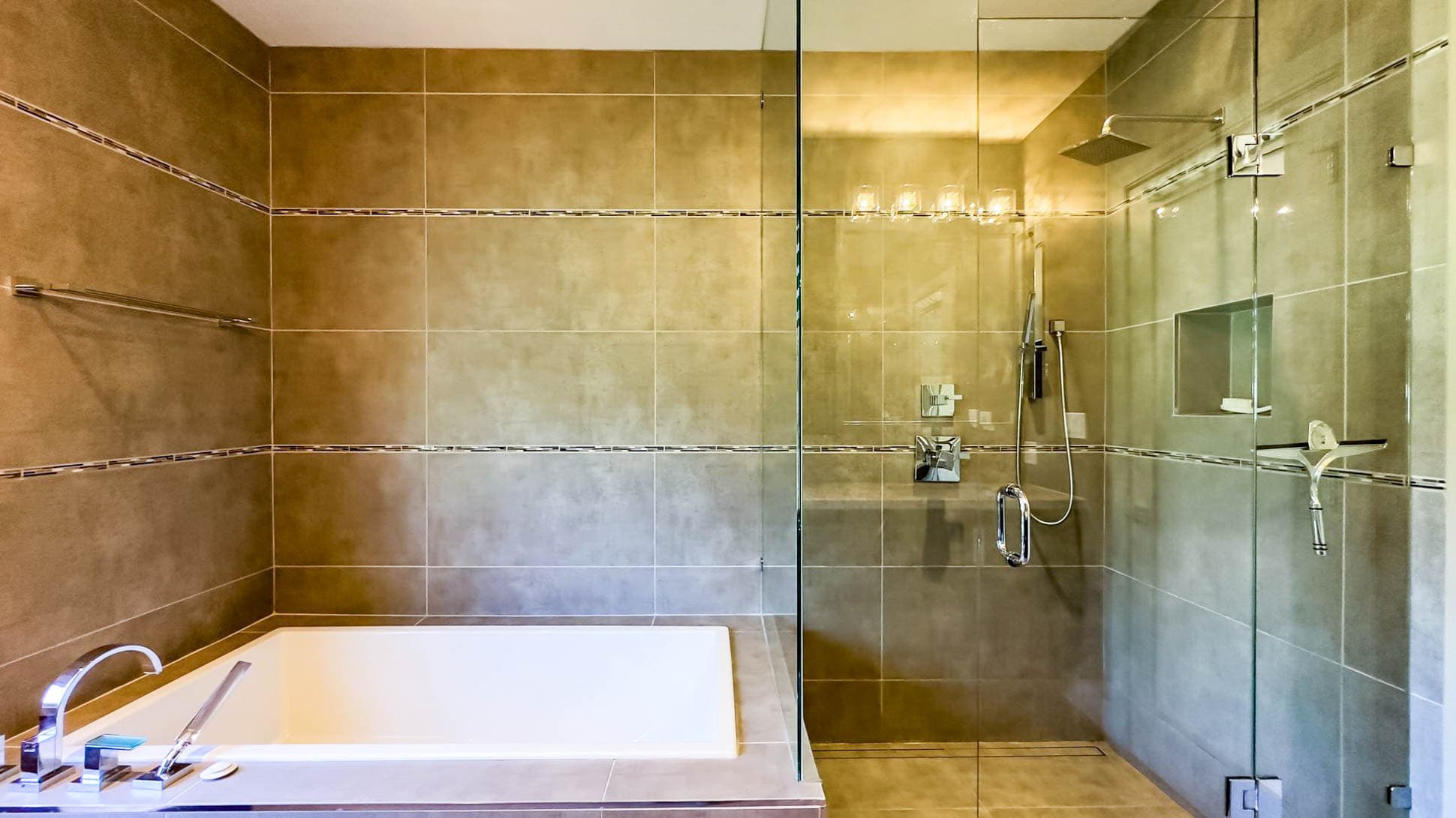 Pamper yourself in style with our ensuite's oversized shower and inviting bath