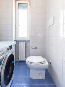 Secondary Bathroom with Washer-Dryer and Courtesy Kit