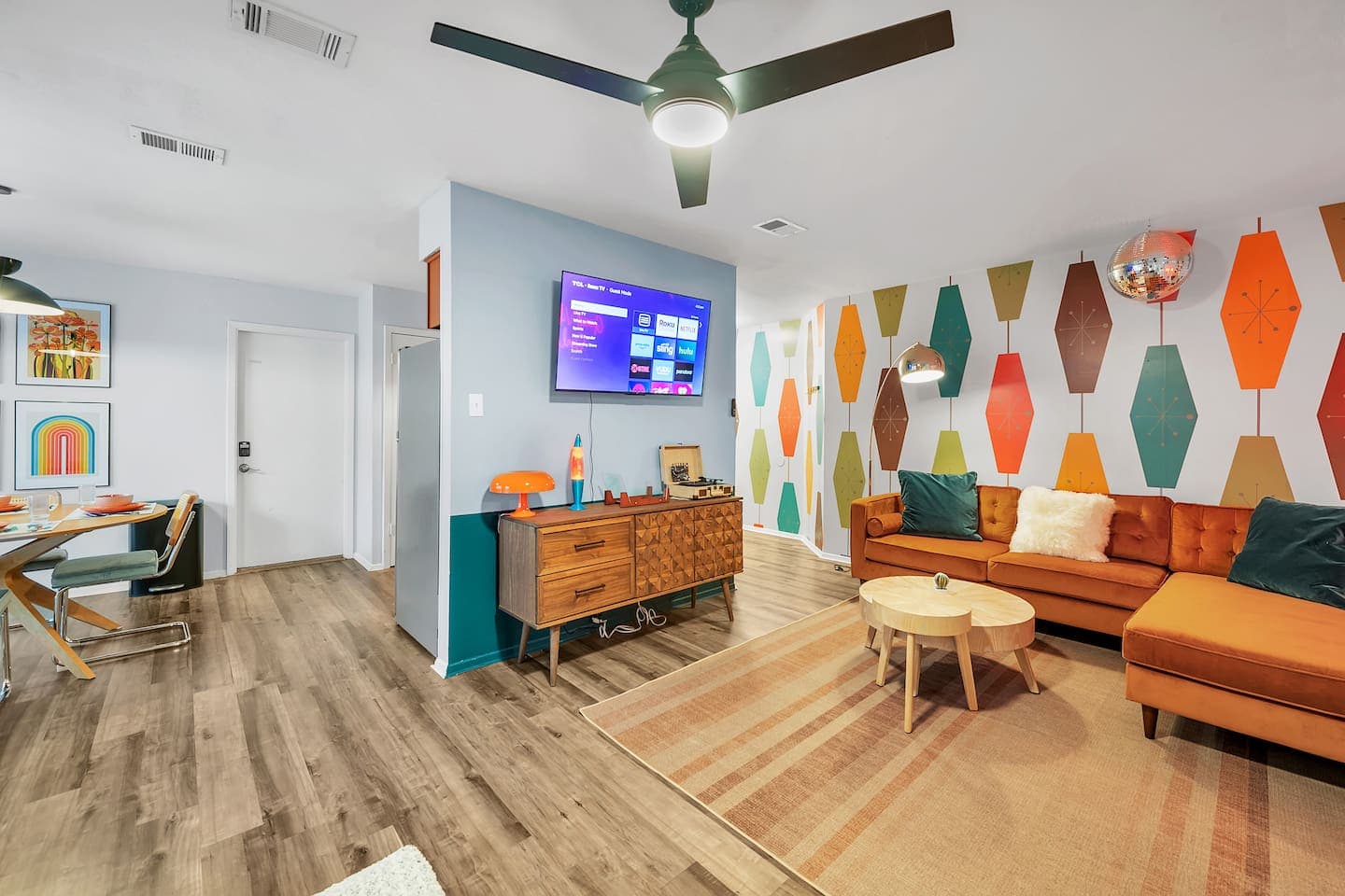 Get groovy in this retro living room with a swinging TV that angles towards the sofa