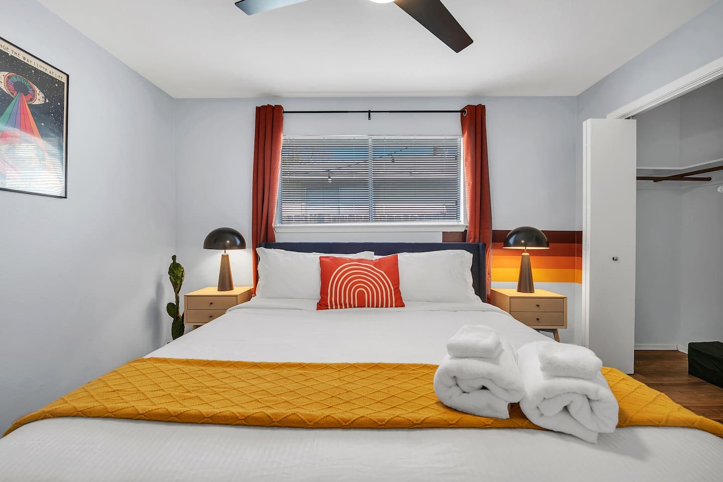 Our retro and vibey king-size bedroom with a spacious wardrobe.