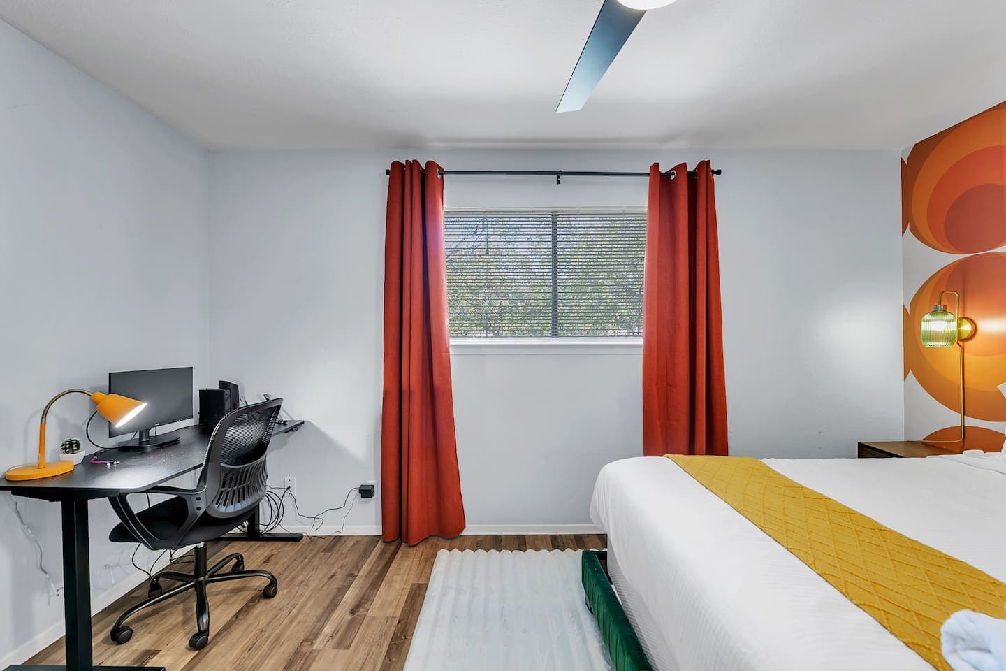 Bedroom with a dedicated workspace and a stunning window view.