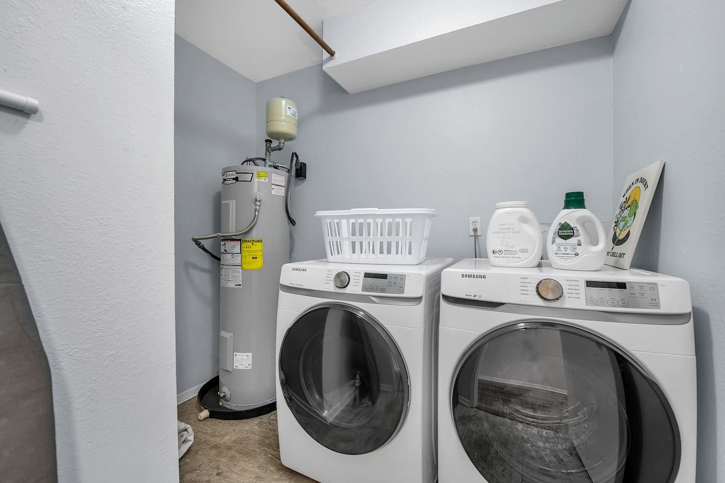 Clean clothes, happy soul - experience the convenience of our sleek laundry room.