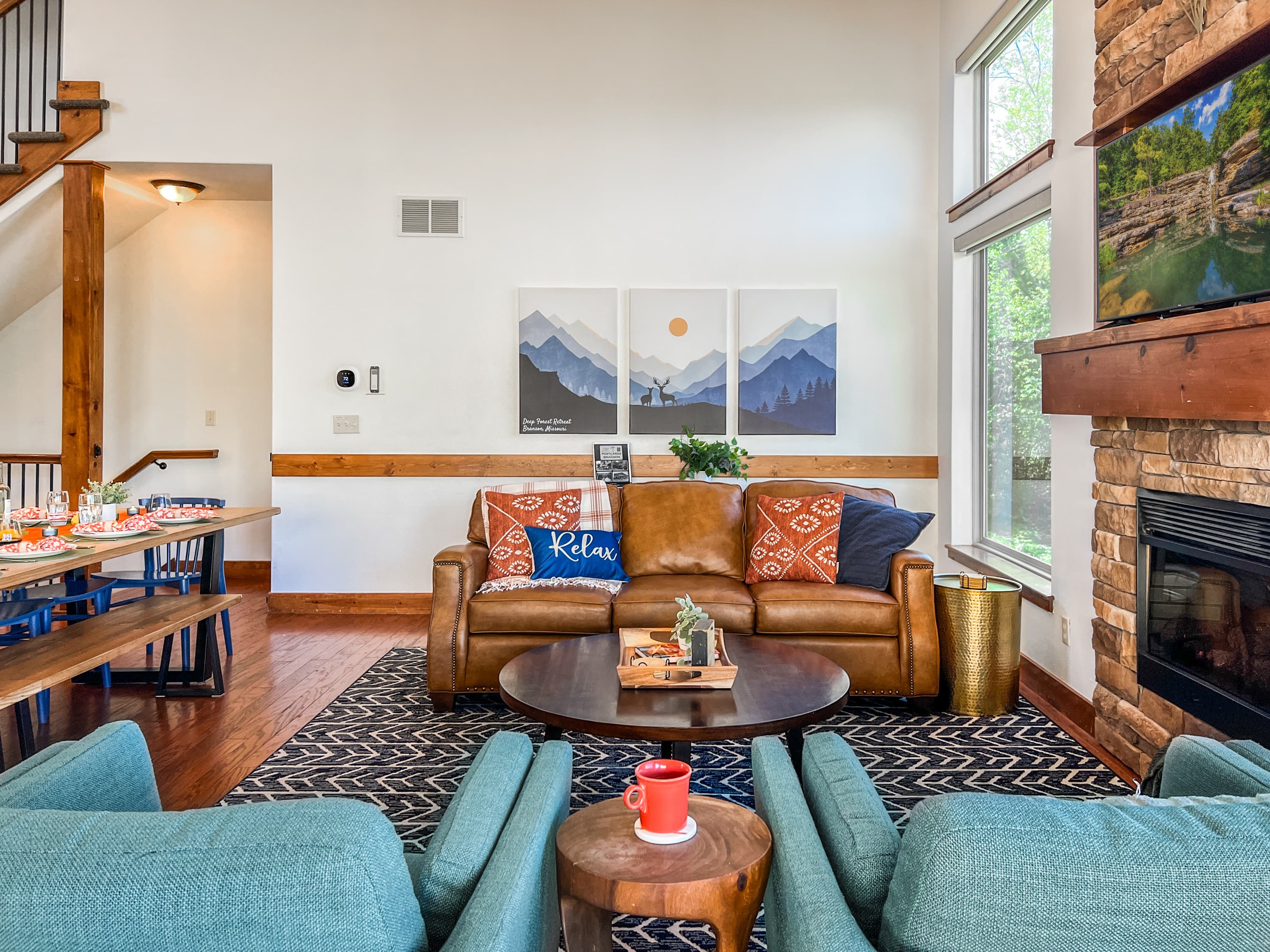 Gather by the fireplace in this inviting seating area, perfect for cozy evenings. The living room is made for lingering conversations