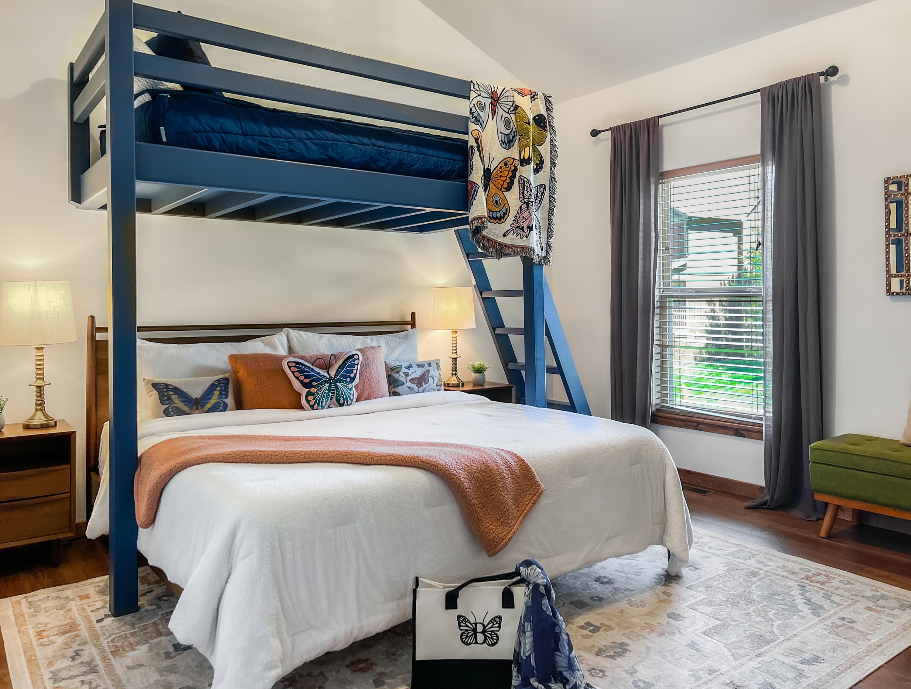 Climb up to the butterfly loft bed — a playful Twin XL bunk above a cozy sleeping space below