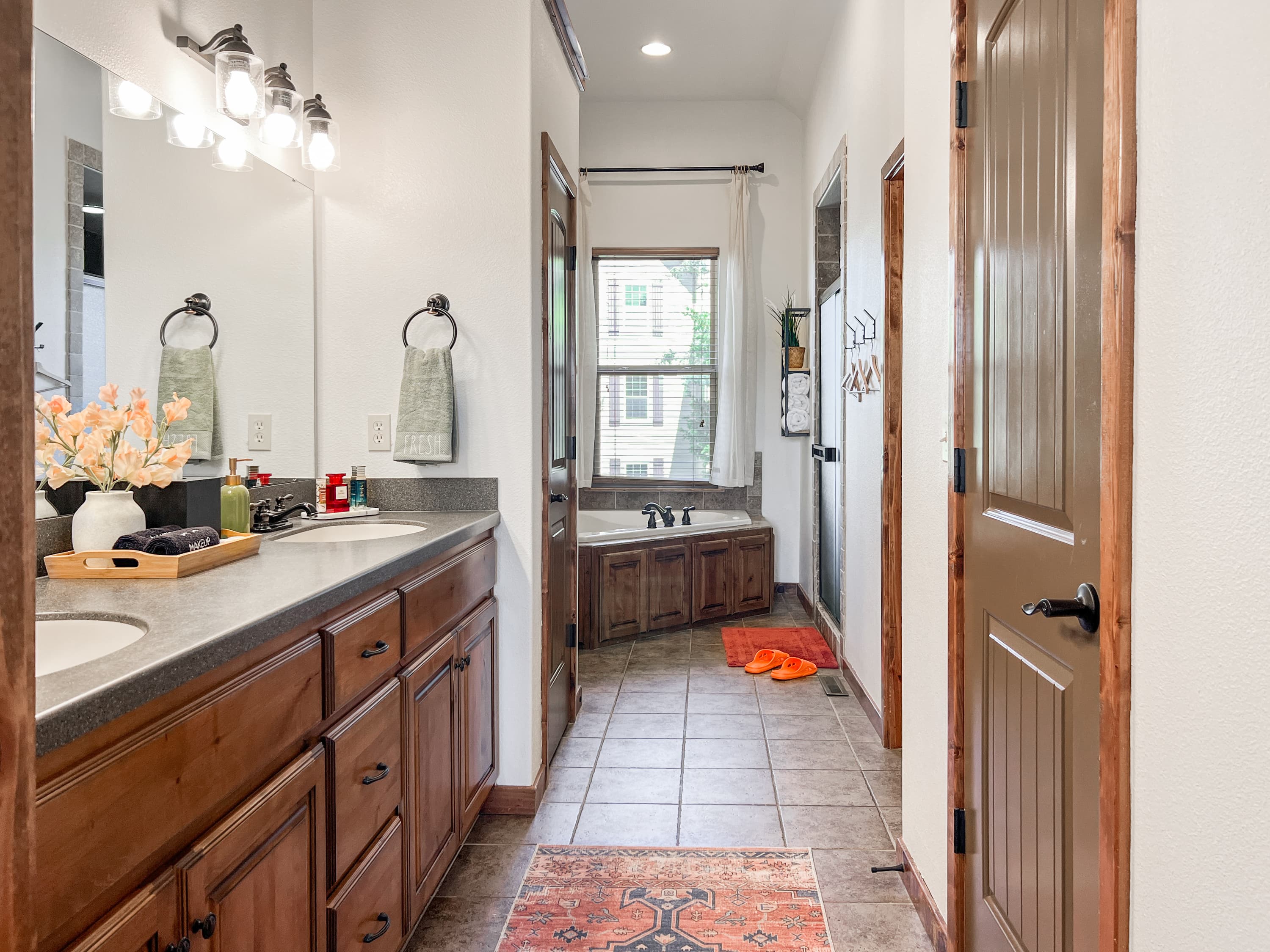 Start or end the day in the enormous upstairs master bath — every detail was thought through