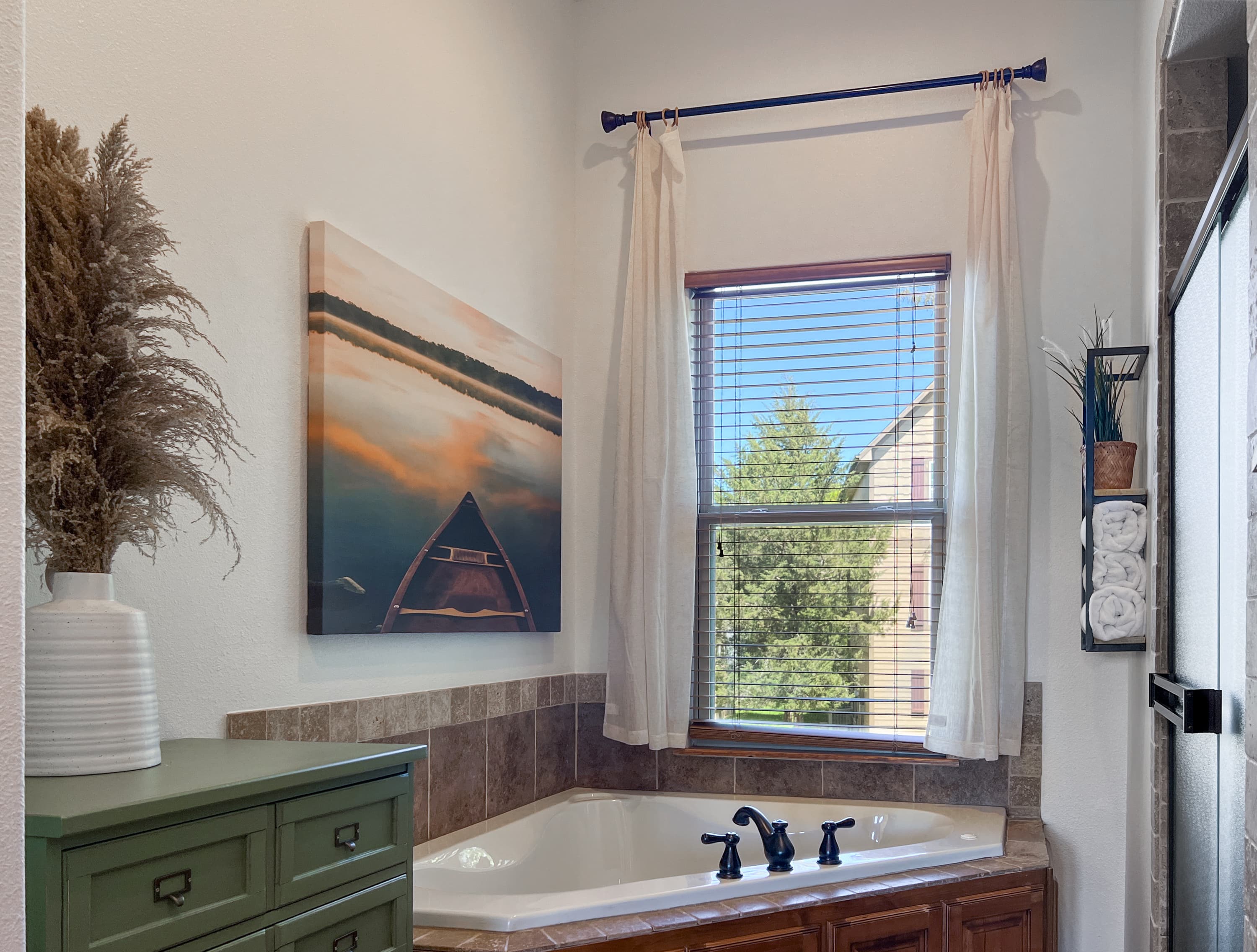 Soak in the enormous jetted tub while watching the sky through the window above