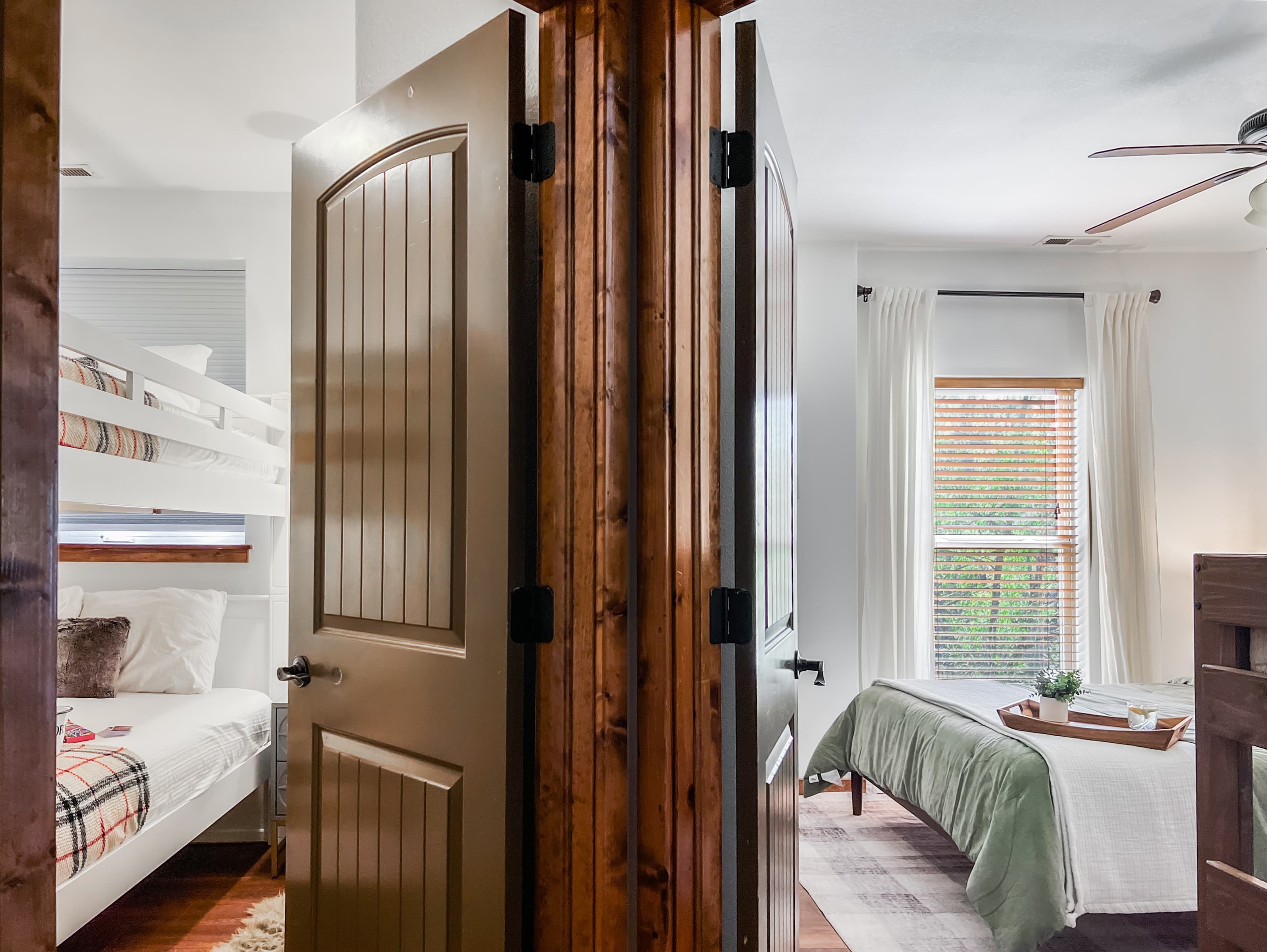 The downstairs hallway leads to two family-friendly rooms — perfectly positioned near the game room