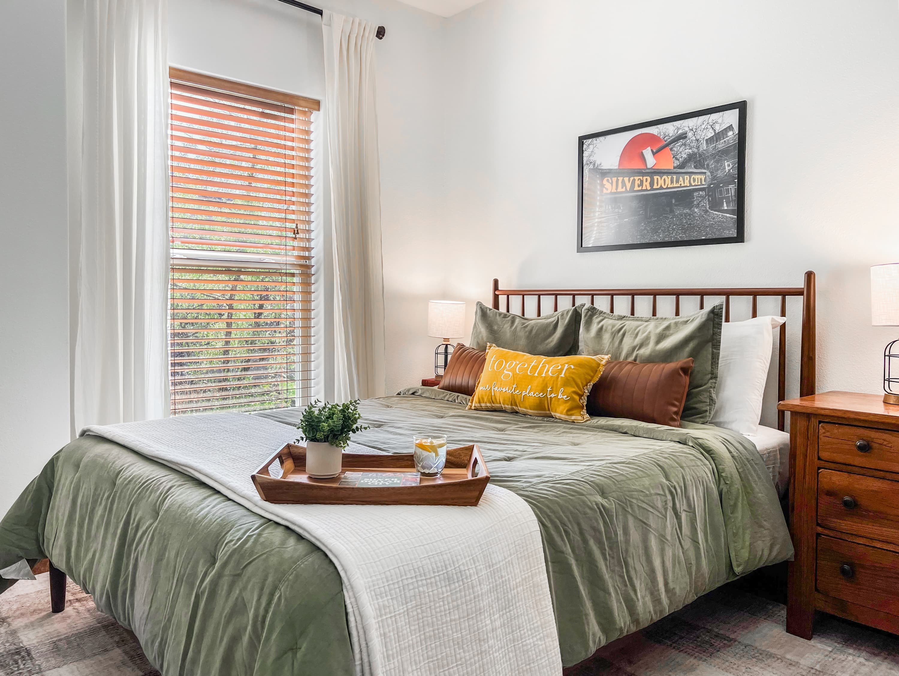 Sleep in the Silver Dollar City room — a queen bed + Twin XL bunk with full SDC theming