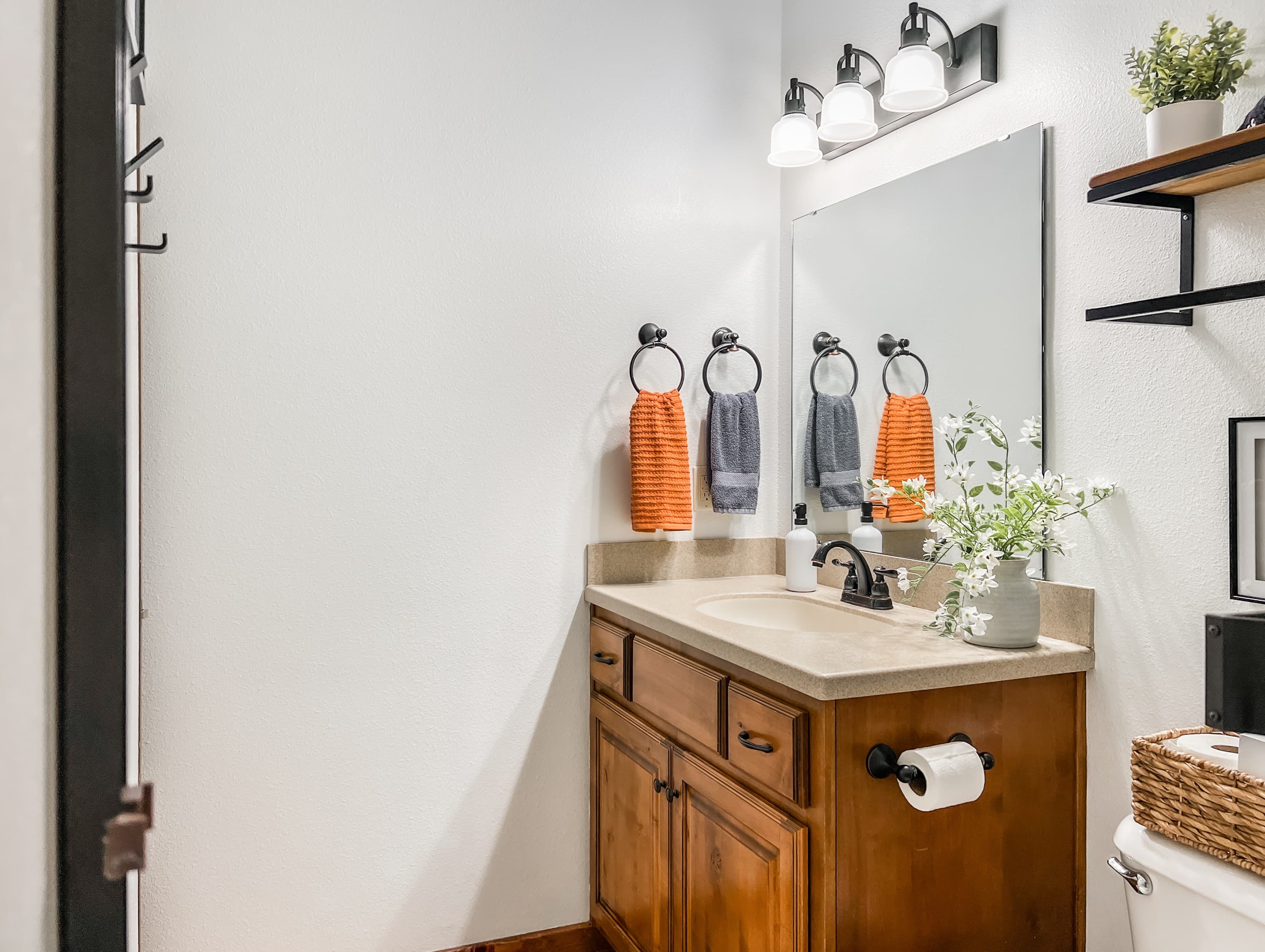 The downstairs guest bathroom is stocked and ready — towels, soaps, and everything you need