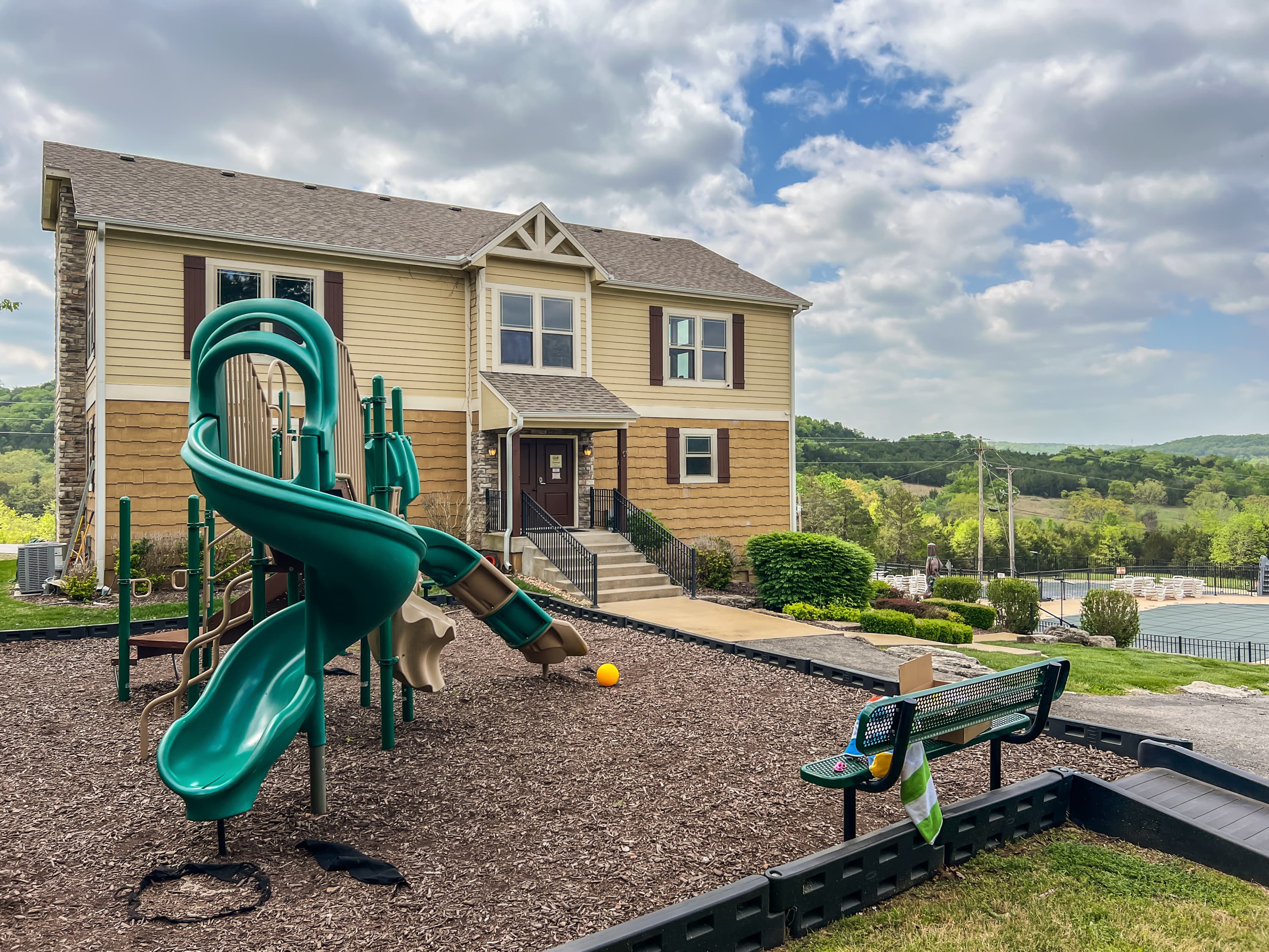 The playground has climbing features, slides, and room to run — kids will want to stay all day