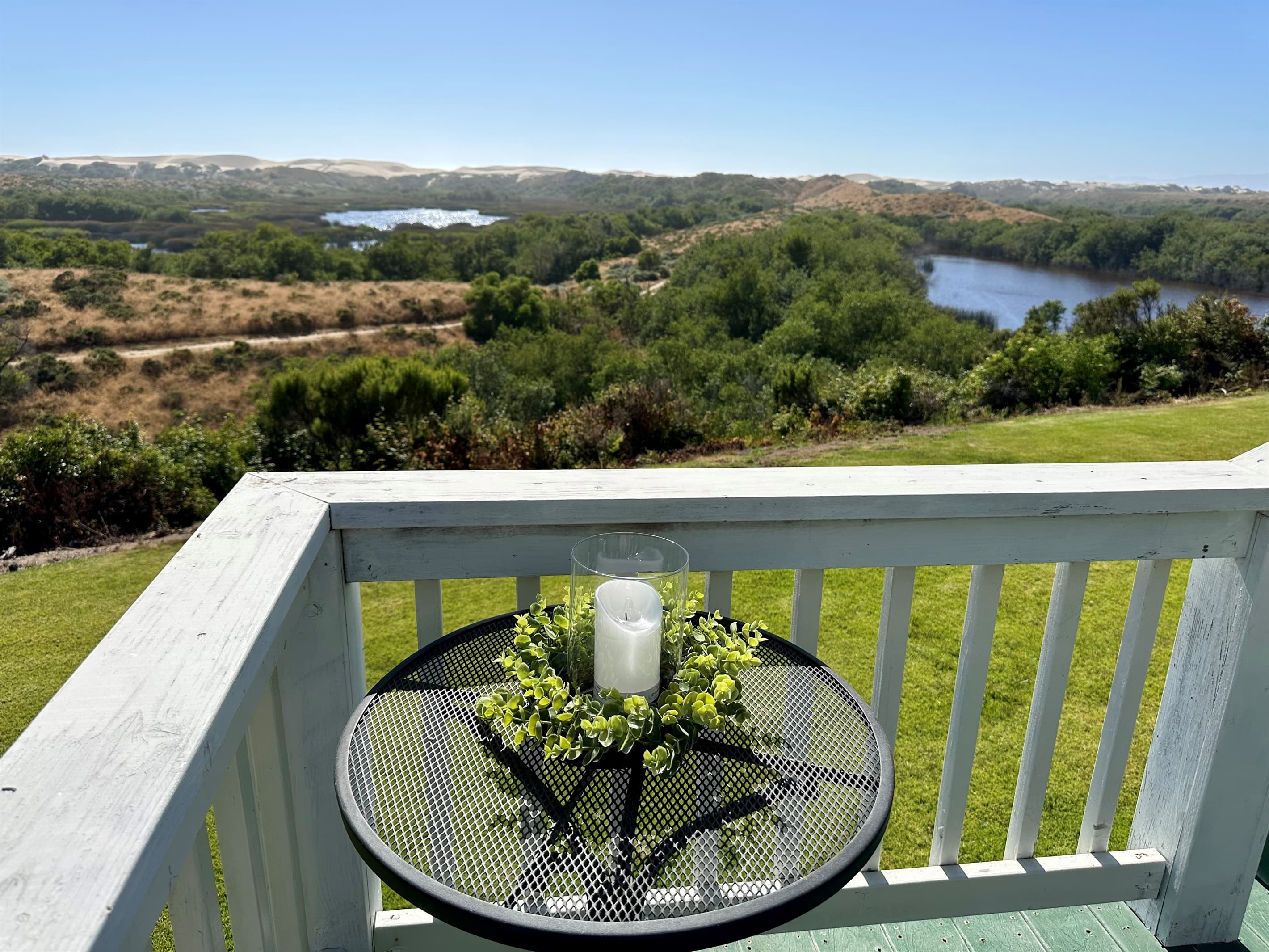 Enjoy wine and cheese at the bistro table overlooking the lake