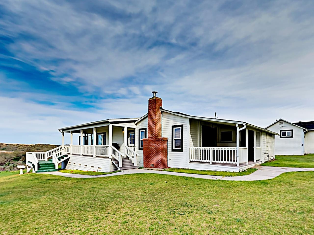 Enjoy the views from The Cottage at Dune Lakes  wrap around deck and covered sun porch that overlook two private lakes and private sand dunes!  The sunsets are epic here.You''ll have complete privacy with only the  birds chirping and ocean waves. 