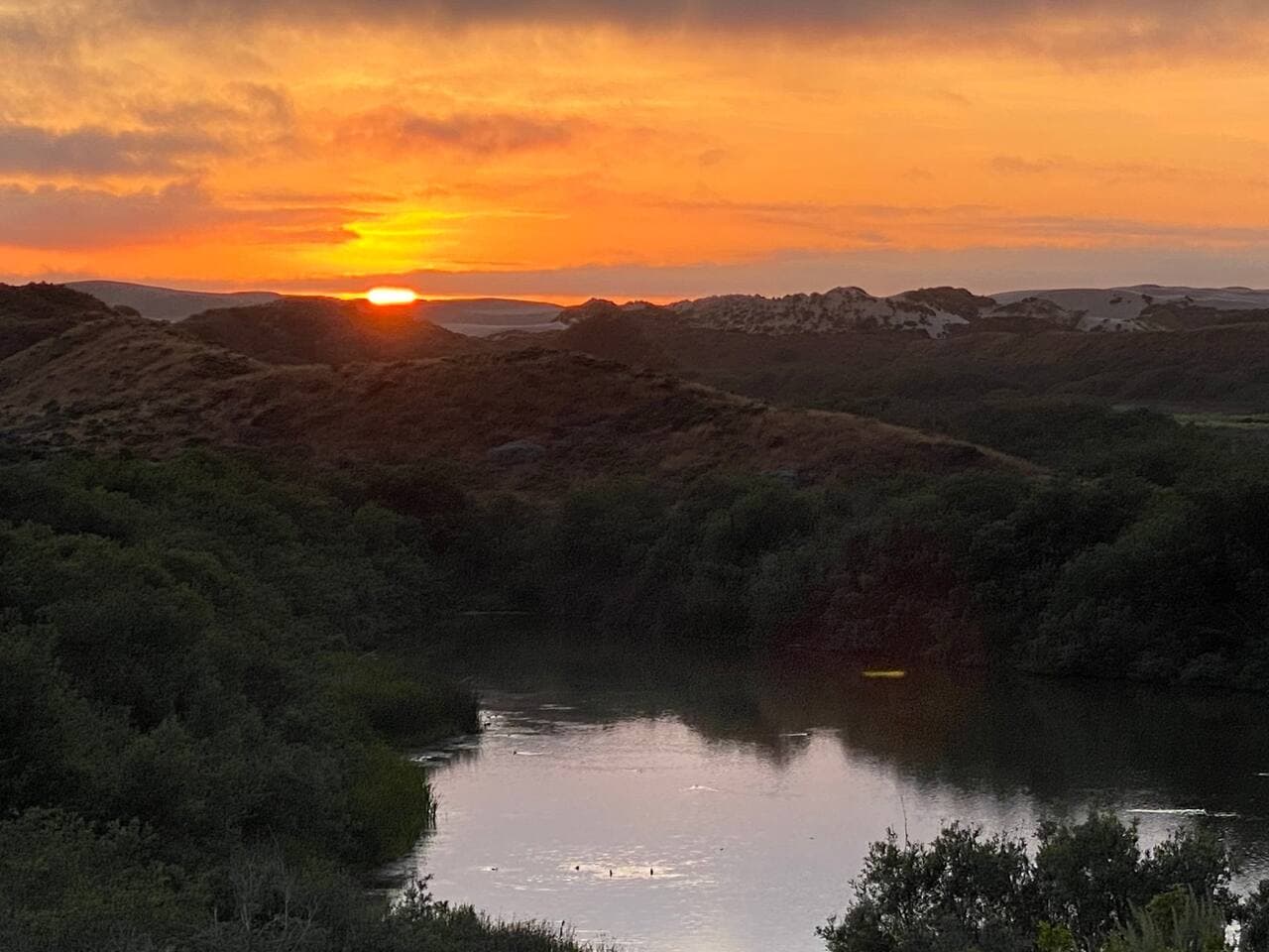 Truly Heaven on Earth!!!We do epic sunsets here at Dune Lakes!  View from back porch of Cottage. 