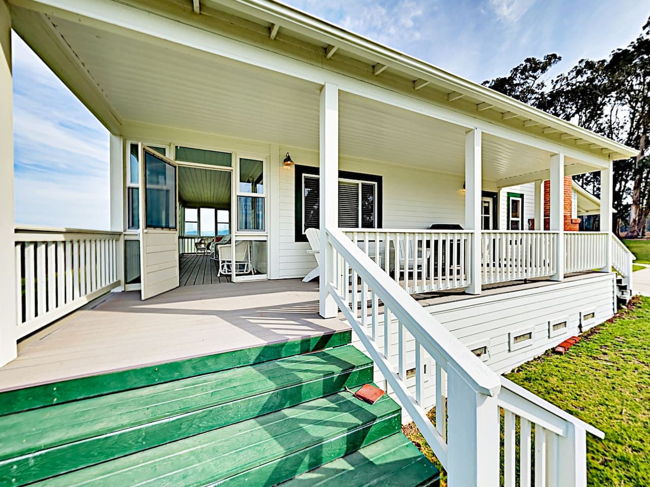 Side Porch with door leading into covered porch.  Sink down into those comfy chairs with a glass of our local wine and just RELAX!  Other than property managers, there are no neighbors to interrupt your R&R-except occasional visits from deer. 