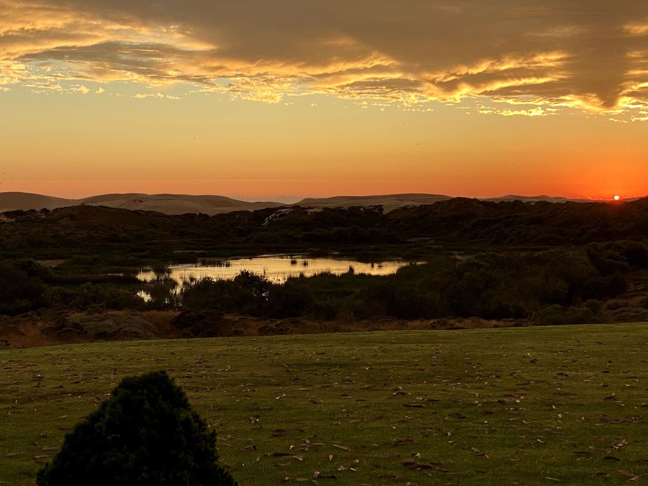 Just another stunning sunset at Dune Lakes!  View from back of Cottage.