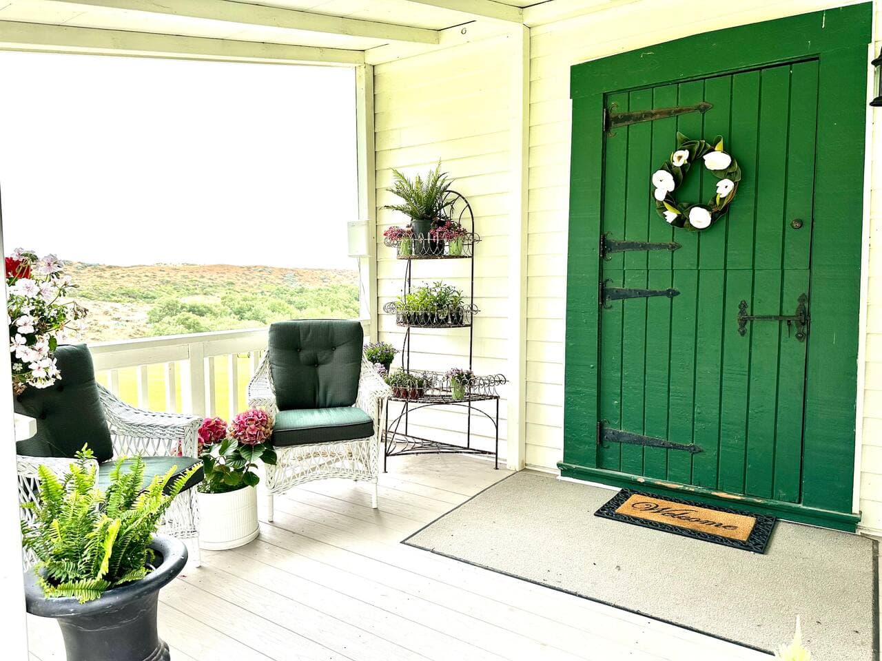 Another sweet vignette to sit and gather!  Time for some front porch time...with views and exclusive serenity.