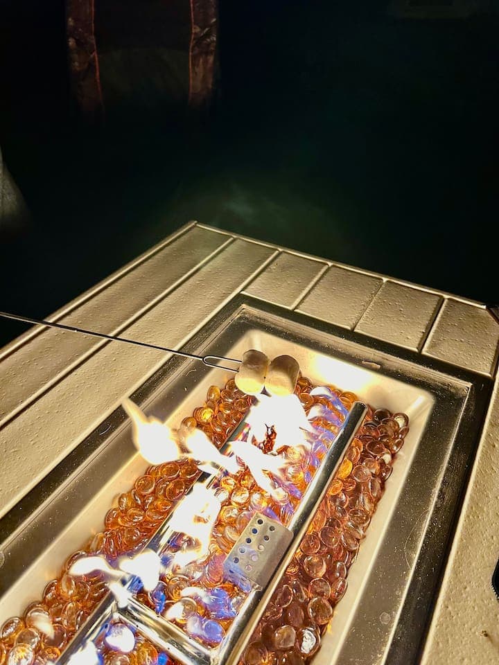 Enjoy sitting around the fire pit in the Adirondack chairs while listening to the sounds of the ocean waves and chorus of frogs on the lake. Is it really summer if you aren't making S'mores over the fire pit??? 